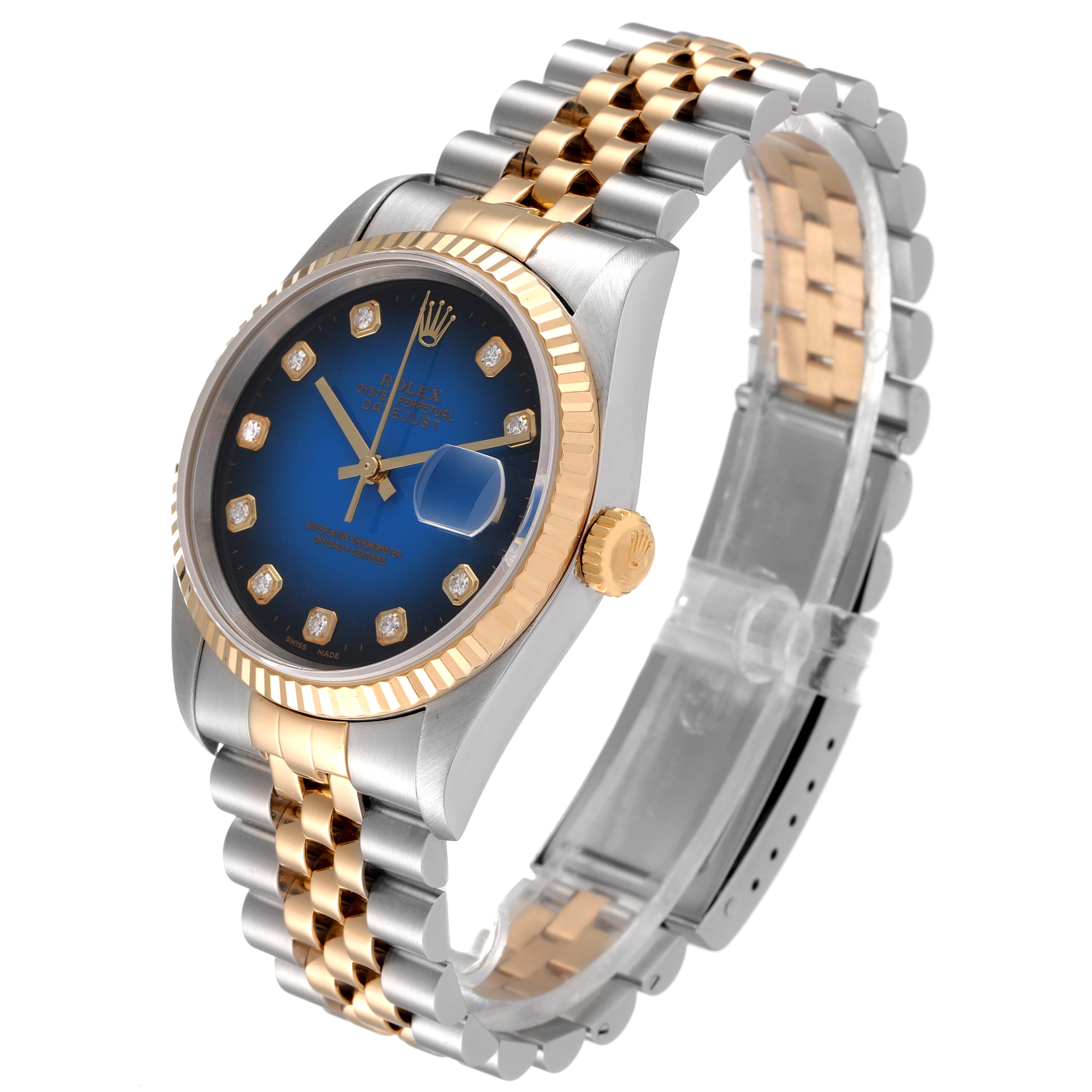 The image shows a Rolex Datejust 16233 Men's Steel and Gold (two tone) Blue Dial 16233 Men's Steel and Gold (two tone) Blue Dial watch at a three-quarter angle, highlighting its dial, bezel, crown, and two-tone bracelet.