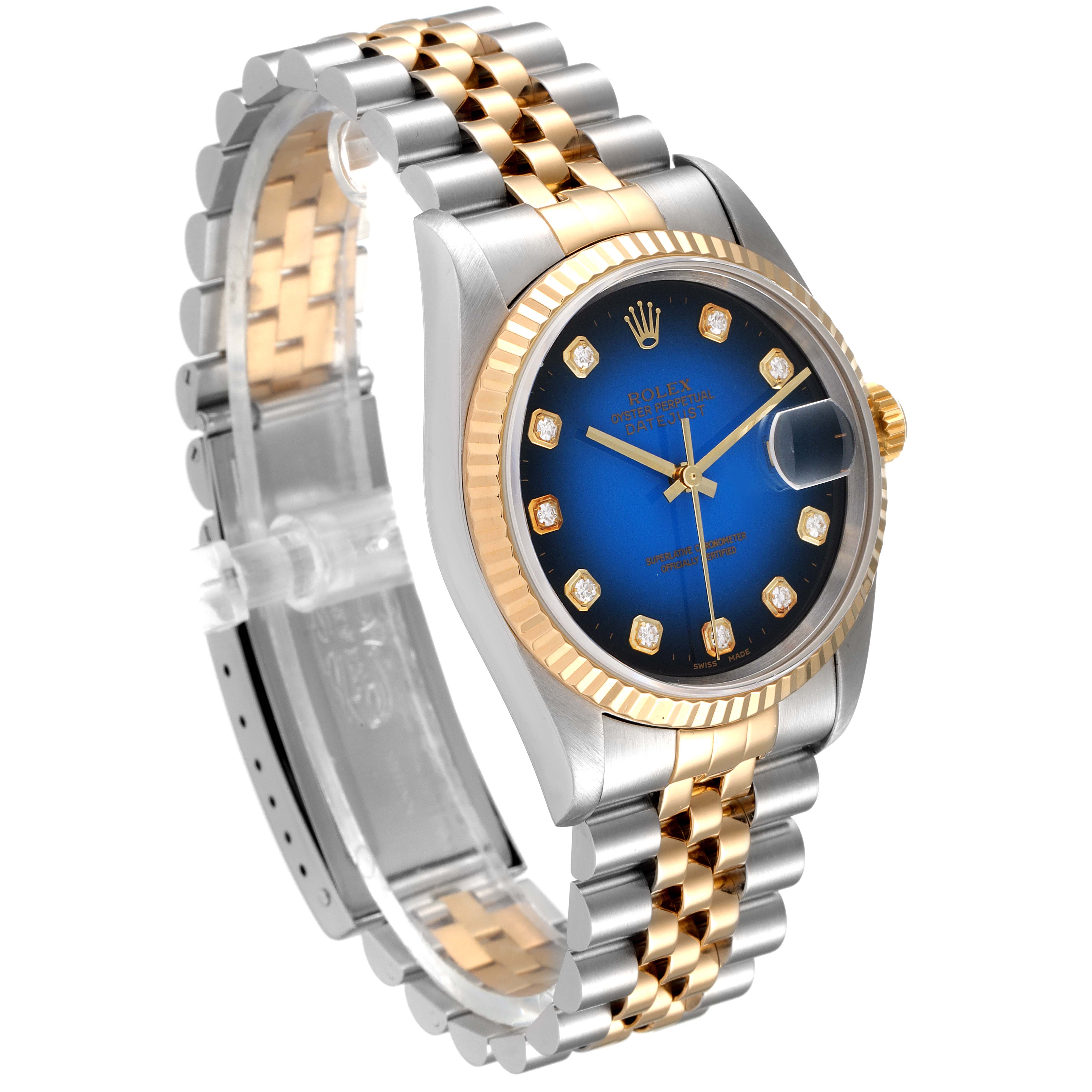 The image shows a Rolex Datejust 16233 Men's Steel and Gold (two tone) Blue Dial 16233 Men's Steel and Gold (two tone) Blue Dial watch from an angled side view, highlighting its two-tone bracelet and blue dial with diamond markers.