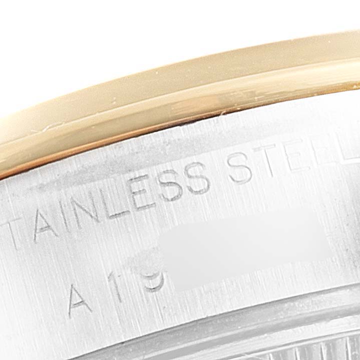 The image shows a close-up of the stainless steel case and bezel of a Rolex Datejust 79163 Women's Steel and Gold (two tone) Blue Dial 79163 Women's Steel and Gold (two tone) Blue Dial watch, highlighting the material text.