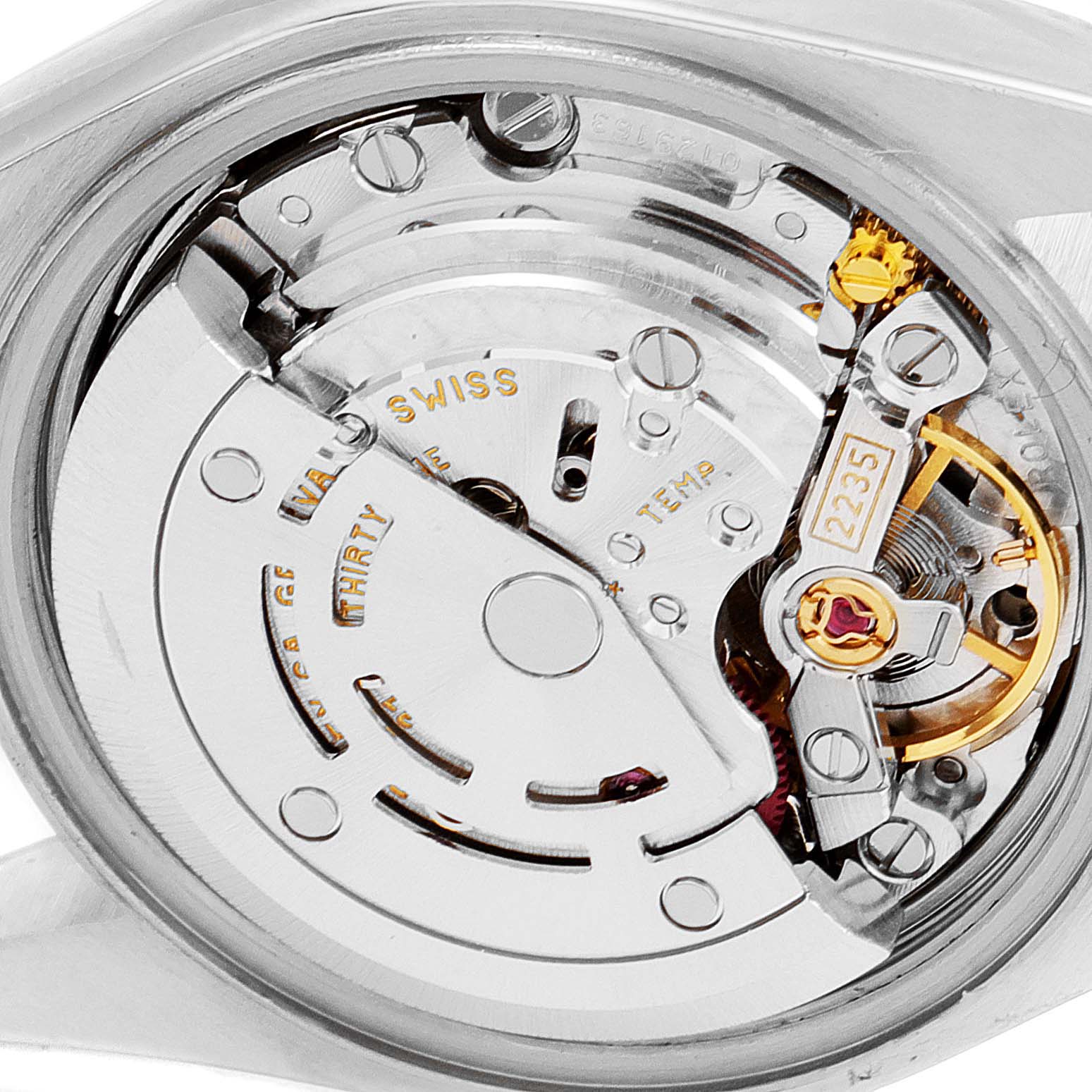 This close-up shot shows the movement mechanism inside a Rolex Datejust 79163 Women's Steel and Gold (two tone) Blue Dial 79163 Women's Steel and Gold (two tone) Blue Dial watch, highlighting its intricate components and design.