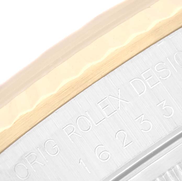 This image shows a close-up of the side engraving and bezel of the Rolex Datejust 16233 Men's Steel and Gold (two tone) Beige Dial 16233 Men's Steel and Gold (two tone) Beige Dial watch.