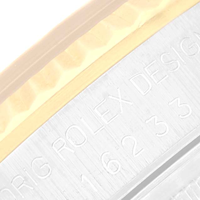 The image shows a close-up view of the case side of a Rolex Datejust 16233 Men's Steel and Gold (two tone) Beige Dial 16233 Men's Steel and Gold (two tone) Beige Dial, with visible engraving details.