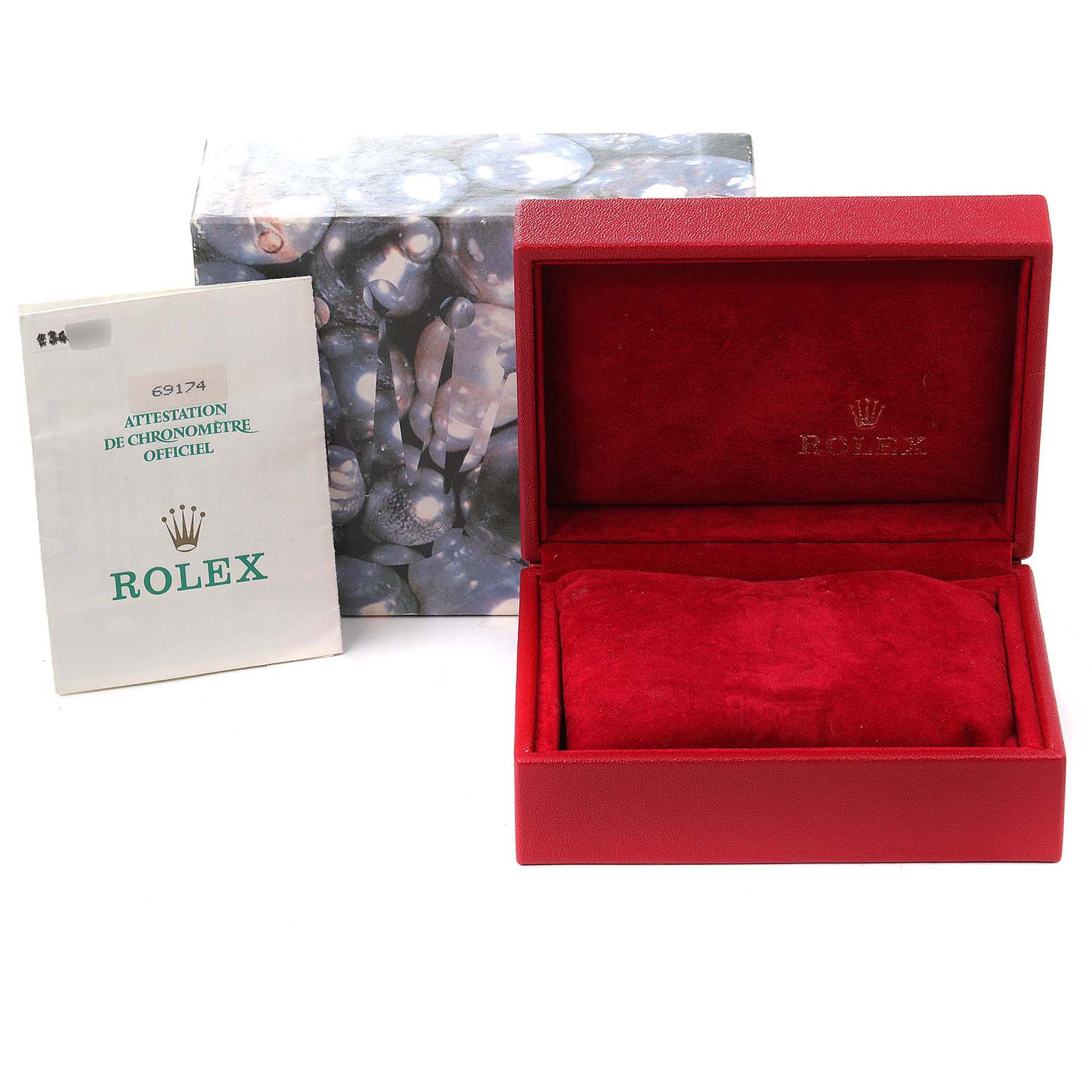 The image shows the accessories for a Rolex Datejust 69174 Women
s Stainless Steel Silver Dial 69174 Women
s Stainless Steel Silver Dial, including a certificate, an outer box, and an open red watch box.