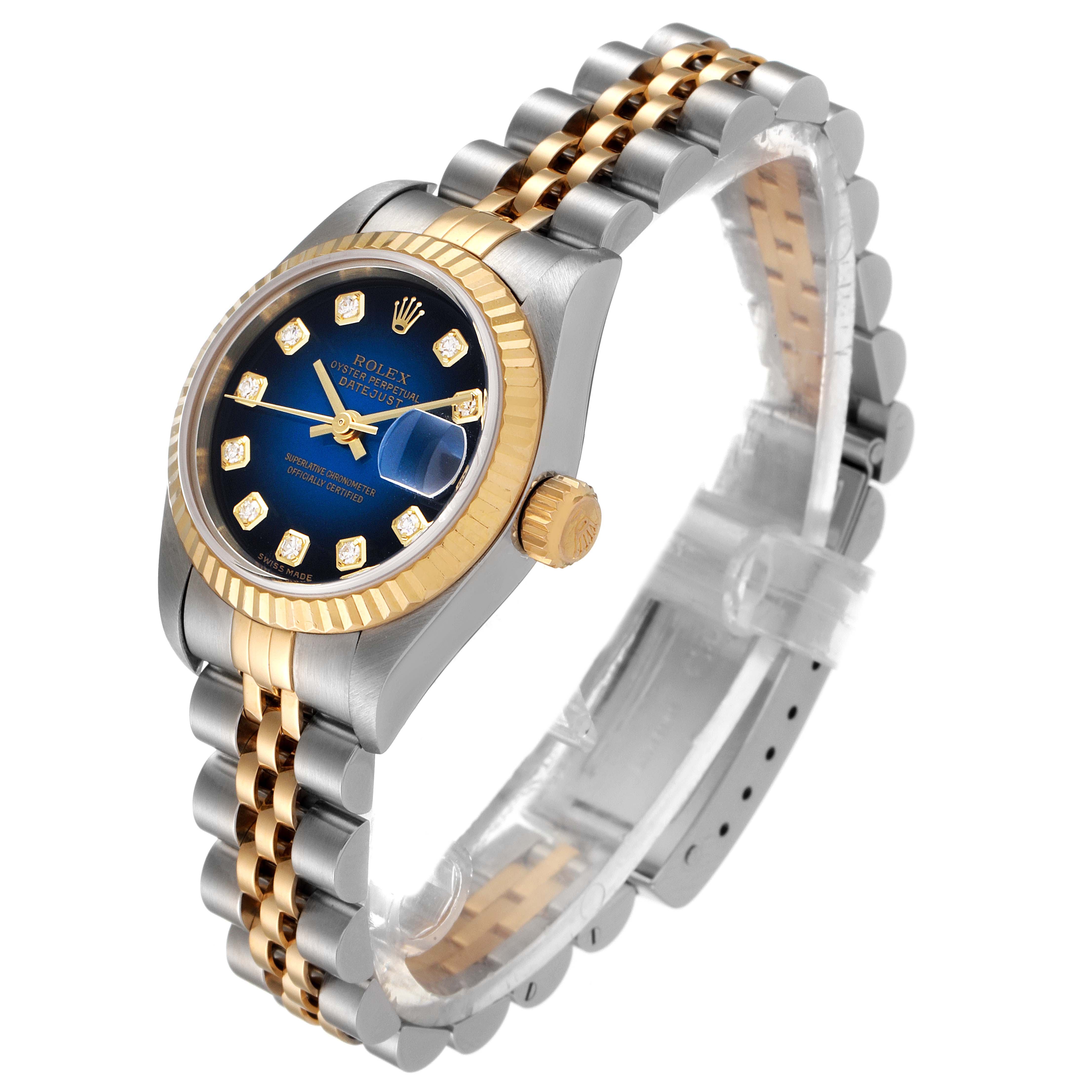 This Rolex Datejust 79173 Women's Steel and Gold (two tone) Blue Dial 79173 Women's Steel and Gold (two tone) Blue Dial watch is shown at an oblique angle, highlighting its face, bezel, crown, and two-tone bracelet.