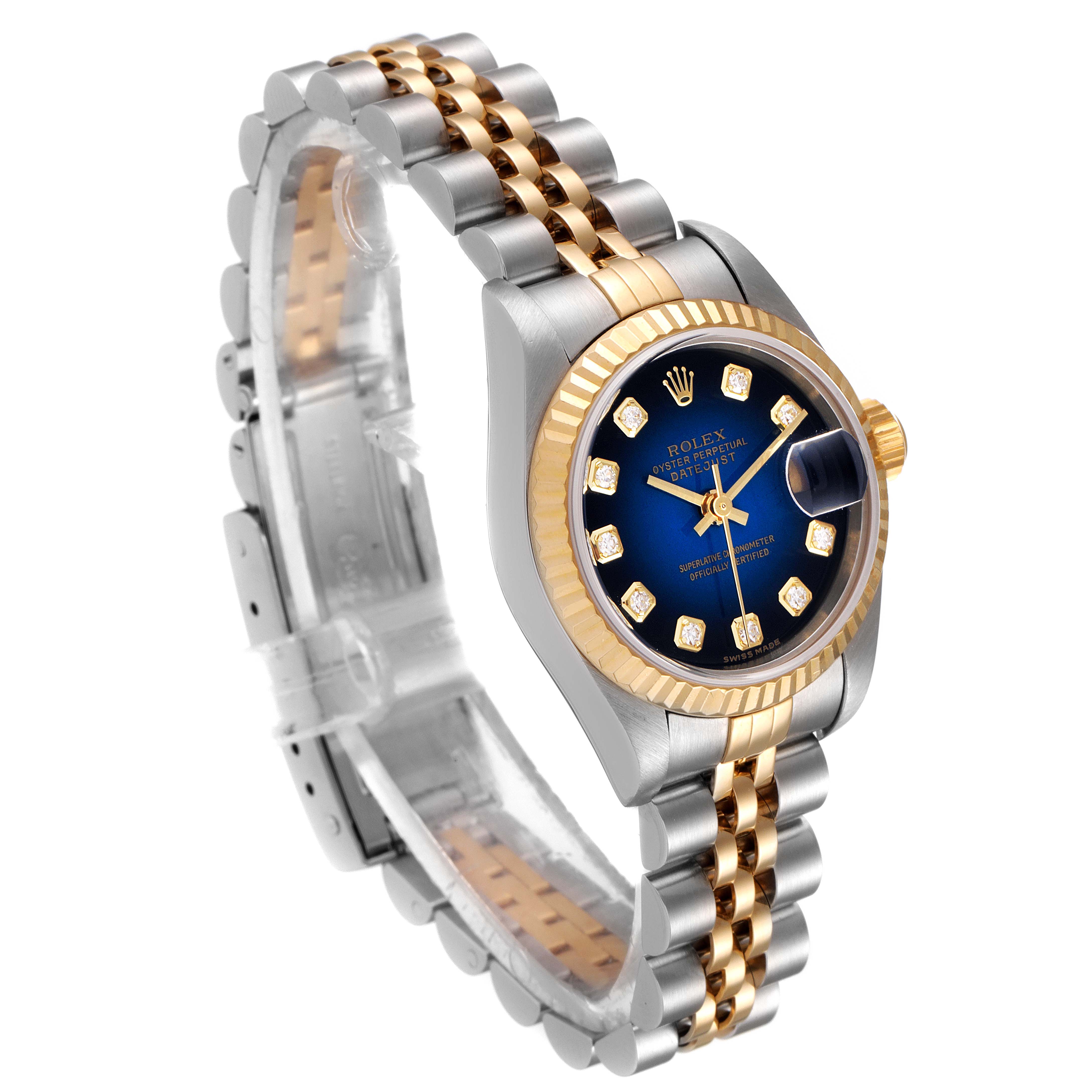 The Rolex Datejust 79173 Women's Steel and Gold (two tone) Blue Dial 79173 Women's Steel and Gold (two tone) Blue Dial watch is shown at a 3/4 angle, displaying its face, bezel, and part of the jubilee bracelet.