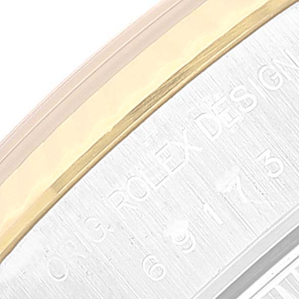 The image shows a close-up of the Rolex Datejust 69173 Women's Steel and Gold (two tone) Champagne Dial 69173 Women's Steel and Gold (two tone) Champagne Dial model's case back, highlighting the engraved "ROLEX DESIGN" text.