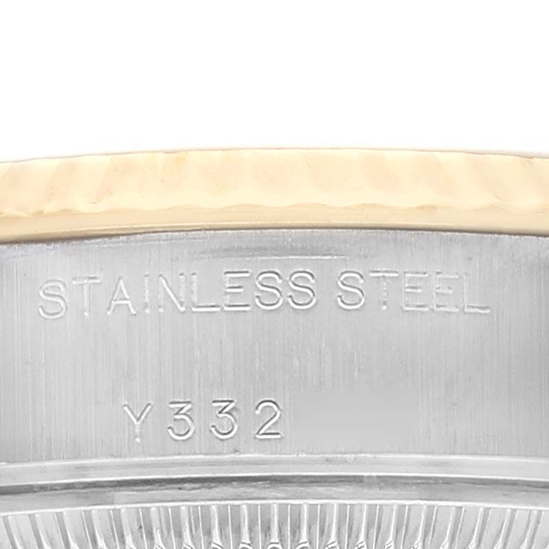 The image shows a close-up of the case back of a stainless steel Rolex Datejust 79173 Women's Steel and Gold (two tone) Champagne Dial 79173 Women's Steel and Gold (two tone) Champagne Dial watch, highlighting its material and serial number.
