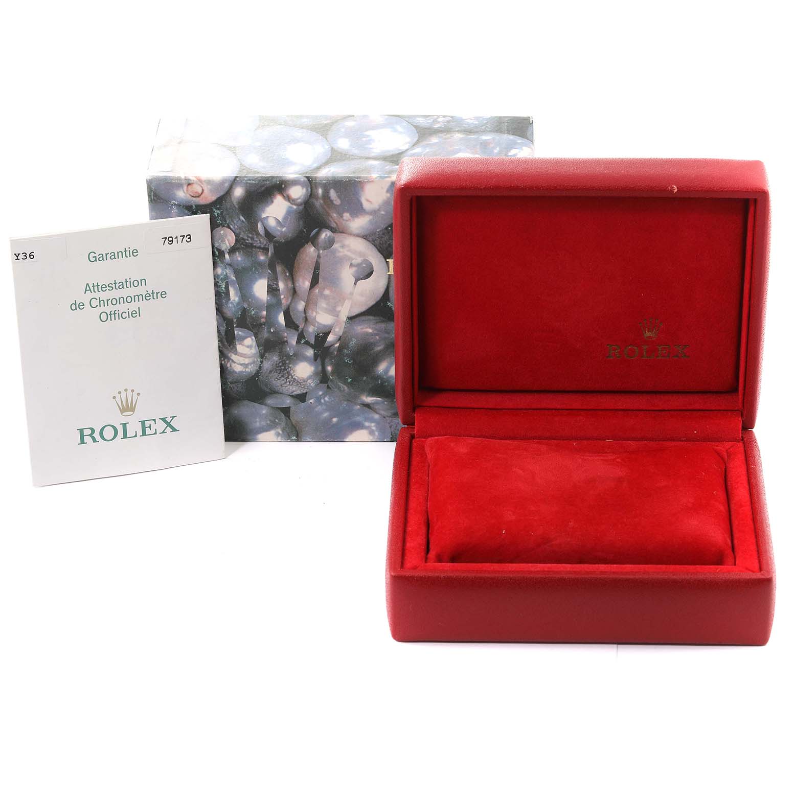 The image shows the Rolex Datejust 79173 Women's Steel and Gold (two tone) Champagne Dial 79173 Women's Steel and Gold (two tone) Champagne Dial watch's red box, warranty booklet, and outer packaging.
