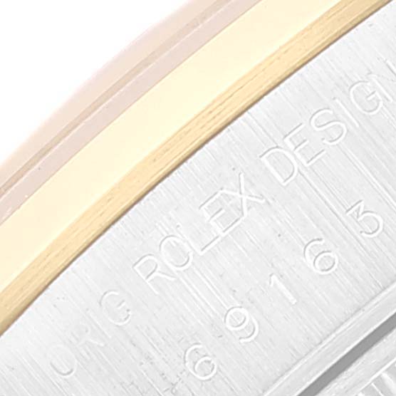 The image shows a close-up angle of the engraved side of the Rolex Datejust 69163 Women's Steel and Gold (two tone) Grey Dial 69163 Women's Steel and Gold (two tone) Grey Dial bezel.