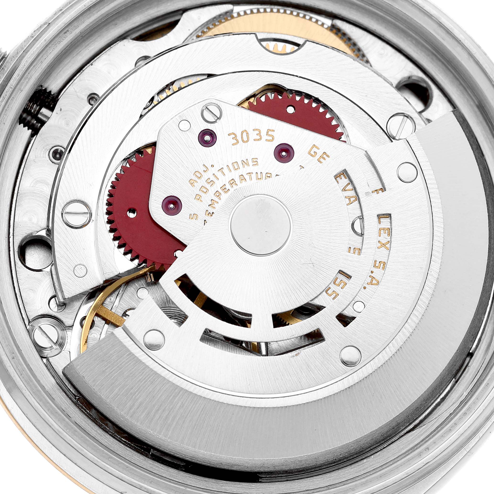 This image shows a close-up of the movement mechanism of a Rolex Vintage Collection 16013 Men's Steel and Gold (two tone) White Dial 16013 Men's Steel and Gold (two tone) White Dial watch, highlighting gears and inscriptions.