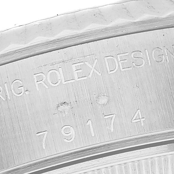 Close-up of the serial number and "ROLEX DESIGN" engraving on the side of the Rolex Datejust 79174 Women's Stainless Steel Silver Dial 79174 Women's Stainless Steel Silver Dial watch case.