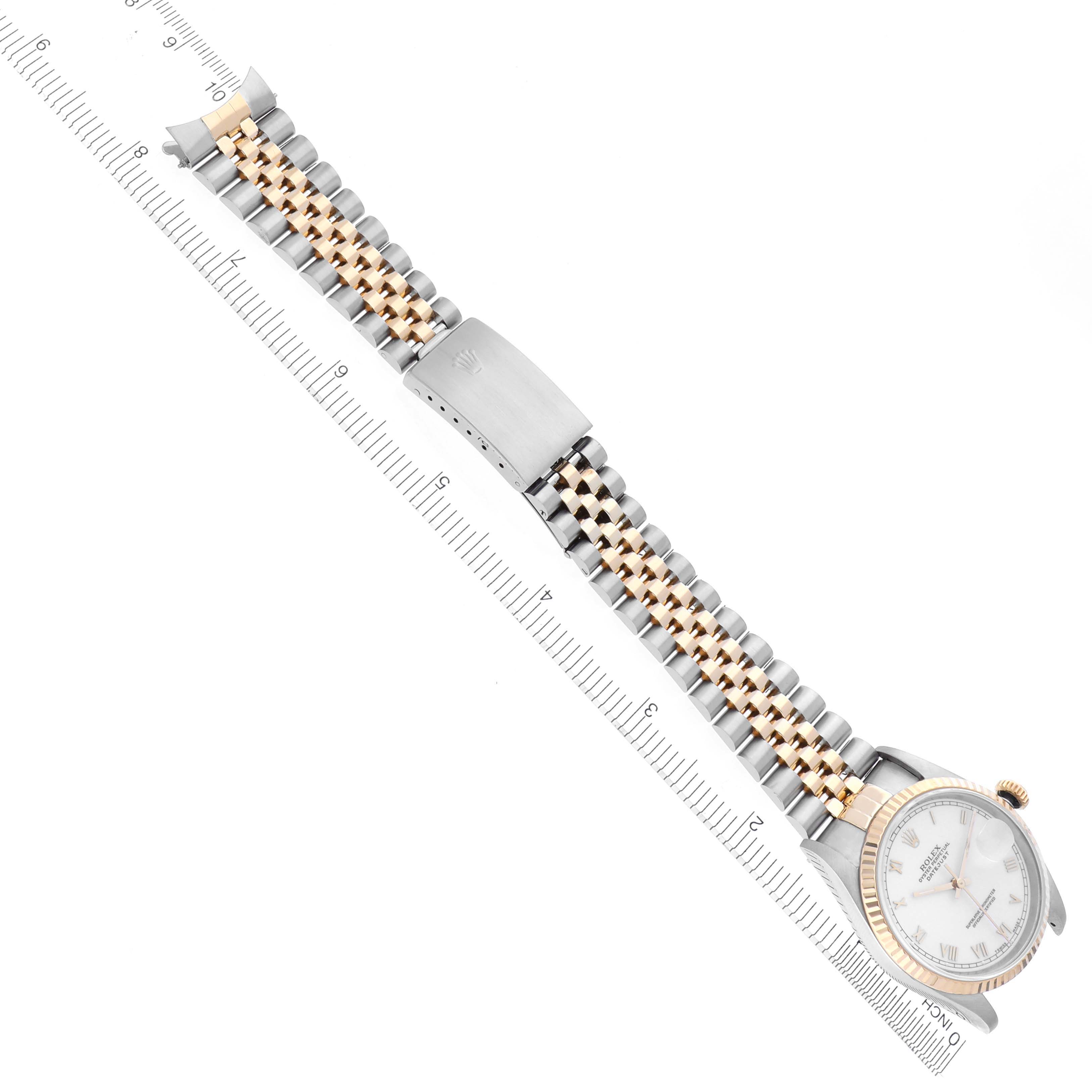 The image shows a Rolex Datejust 16233 Men
s Steel and Gold (two tone) White Dial 16233 Men
s Steel and Gold (two tone) White Dial watch at an angle, highlighting the bracelet, clasp, and face.