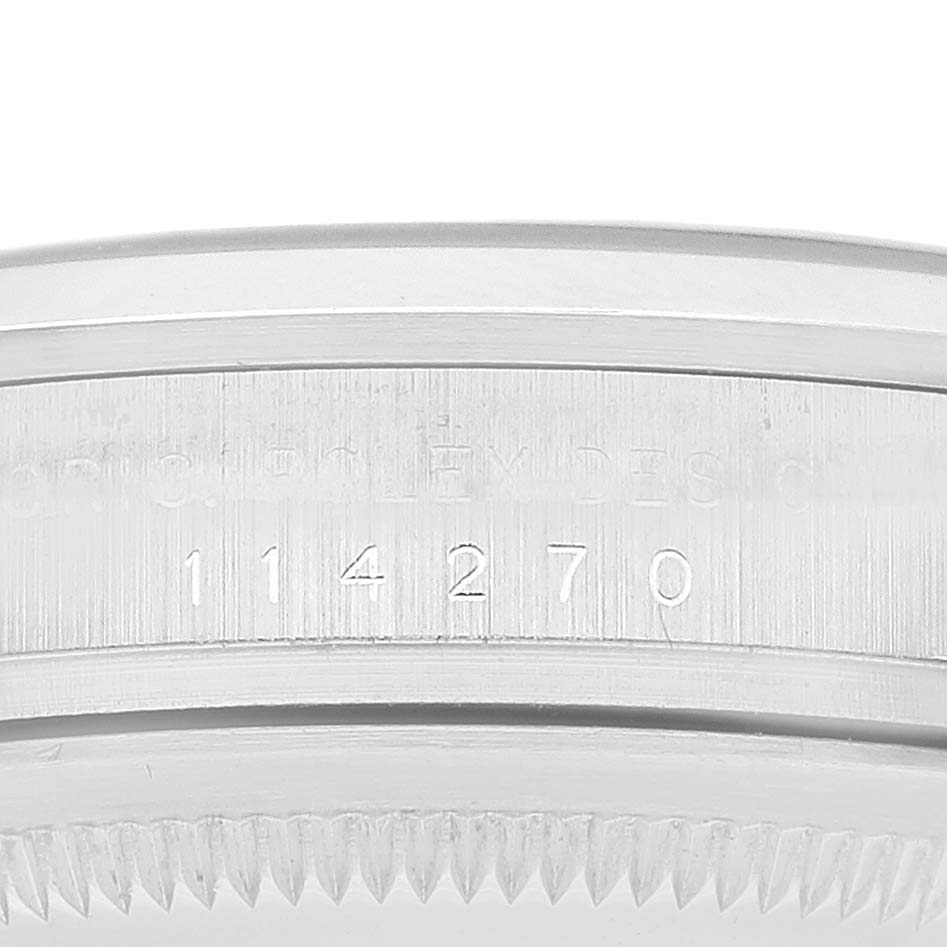 The image shows the side view of the engraved bezel on a Rolex Explorer 114270 Men's Stainless Steel Black Dial 114270 Men's Stainless Steel Black Dial model watch.