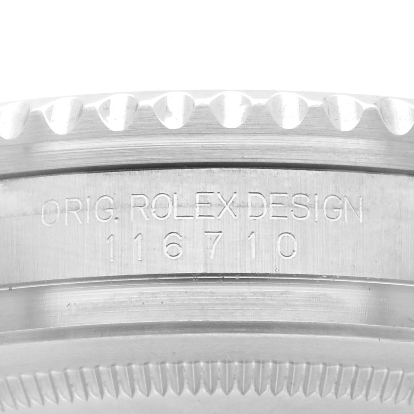 The image shows a close-up of the case side with engravings on the Rolex GMT-Master 116710 Men
s Stainless Steel Black Dial 116710 Men
s Stainless Steel Black Dial model.
