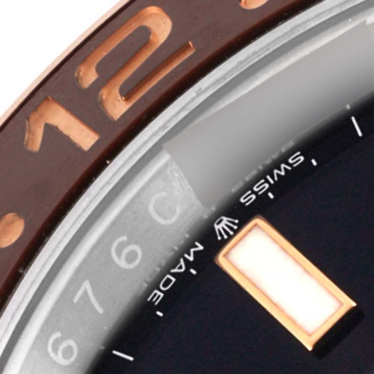 The image shows a close-up of the bezel and dial edge of the Rolex GMT-Master 126711 Men's Steel and Gold (two tone) Black Dial 126711 Men's Steel and Gold (two tone) Black Dial watch.