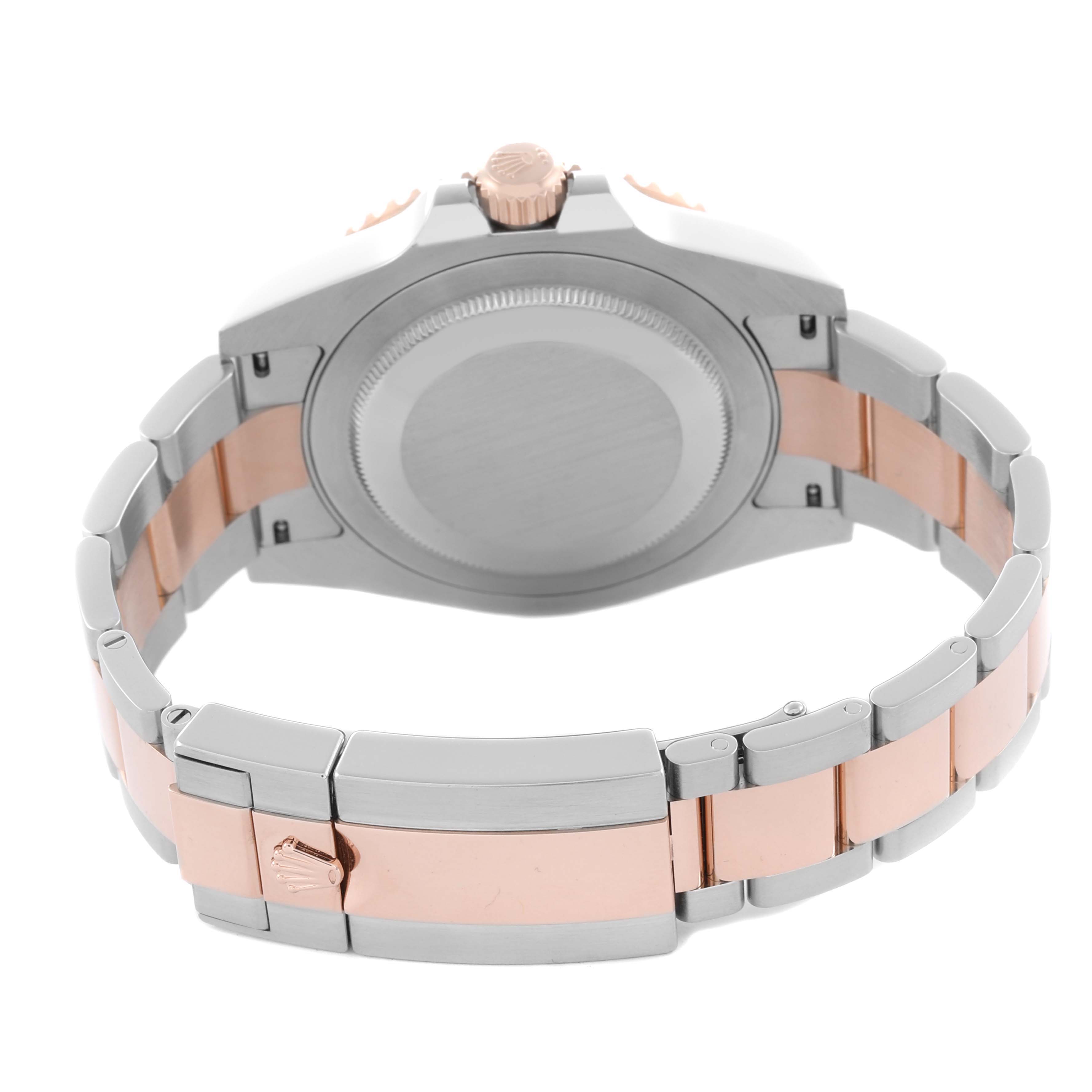 The image shows the back and bracelet of a Rolex GMT-Master 126711 Men's Steel and Gold (two tone) Black Dial 126711 Men's Steel and Gold (two tone) Black Dial, highlighting the clasp and crown.