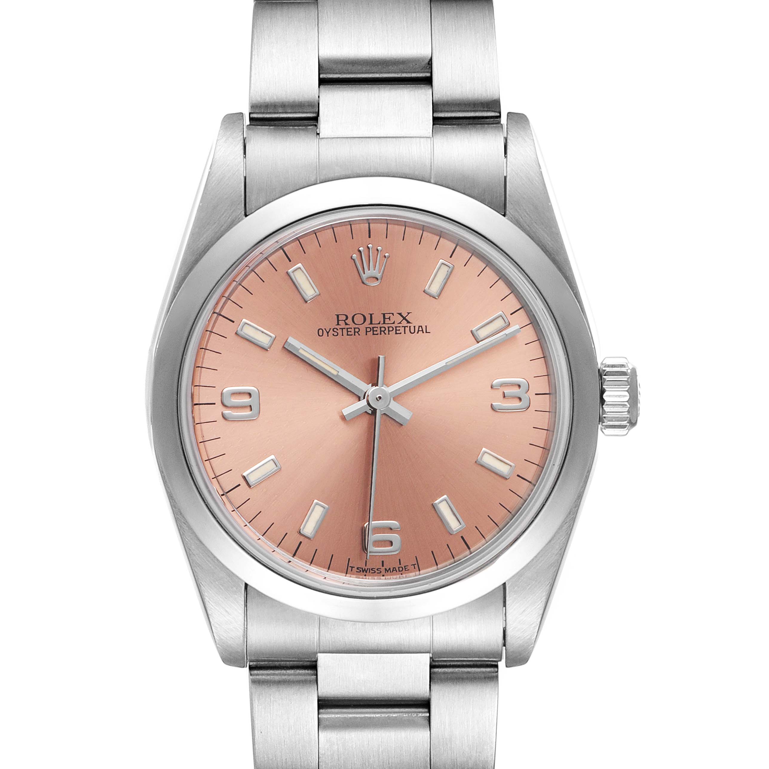 The image shows a front view of a Rolex Oyster Perpetual Mid-Size watch with a silver bracelet and a salmon-pink dial.