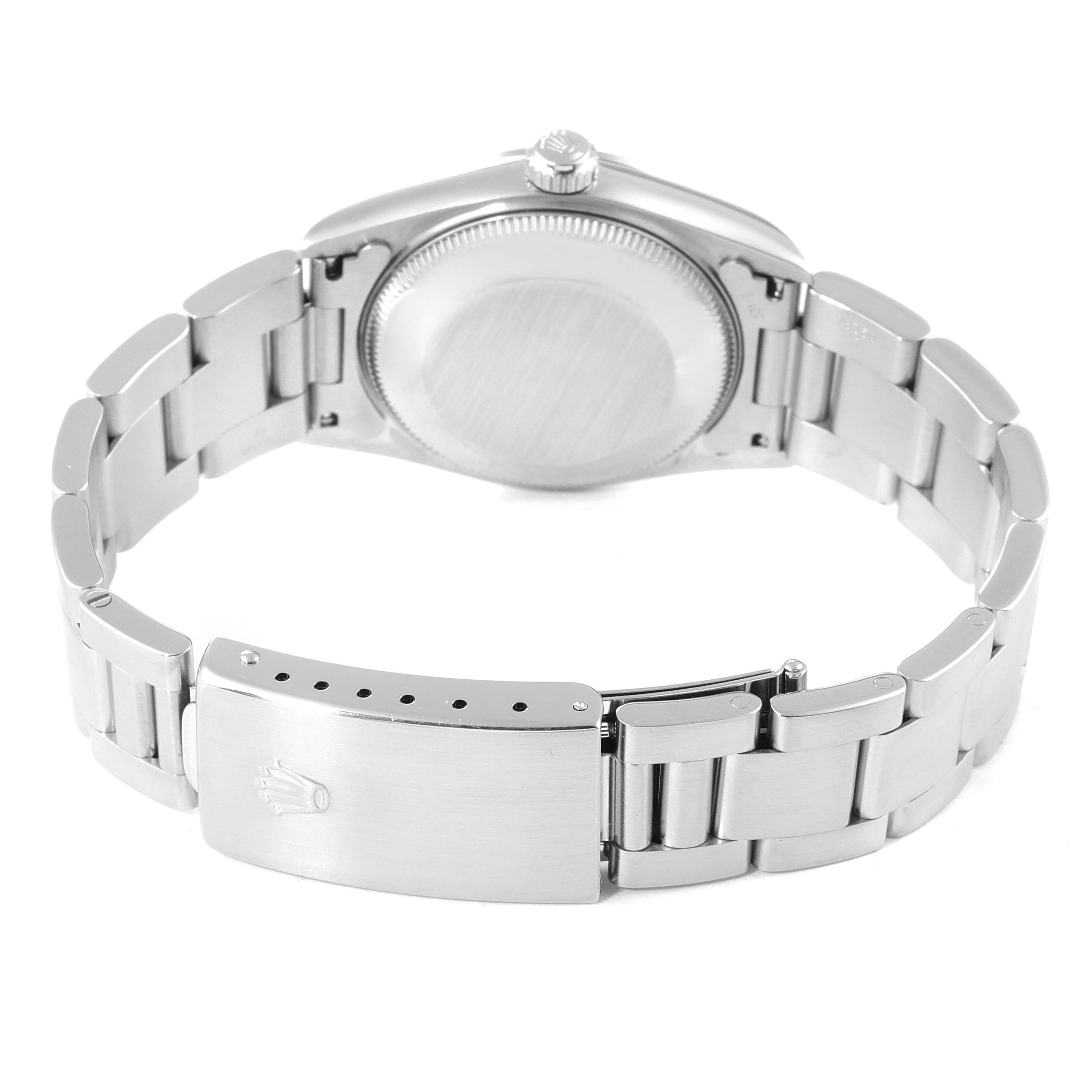 The image shows the back case and bracelet of a Rolex Mid-Size 67480 Women
s Stainless Steel Pink Dial 67480 Women
s Stainless Steel Pink Dial watch.