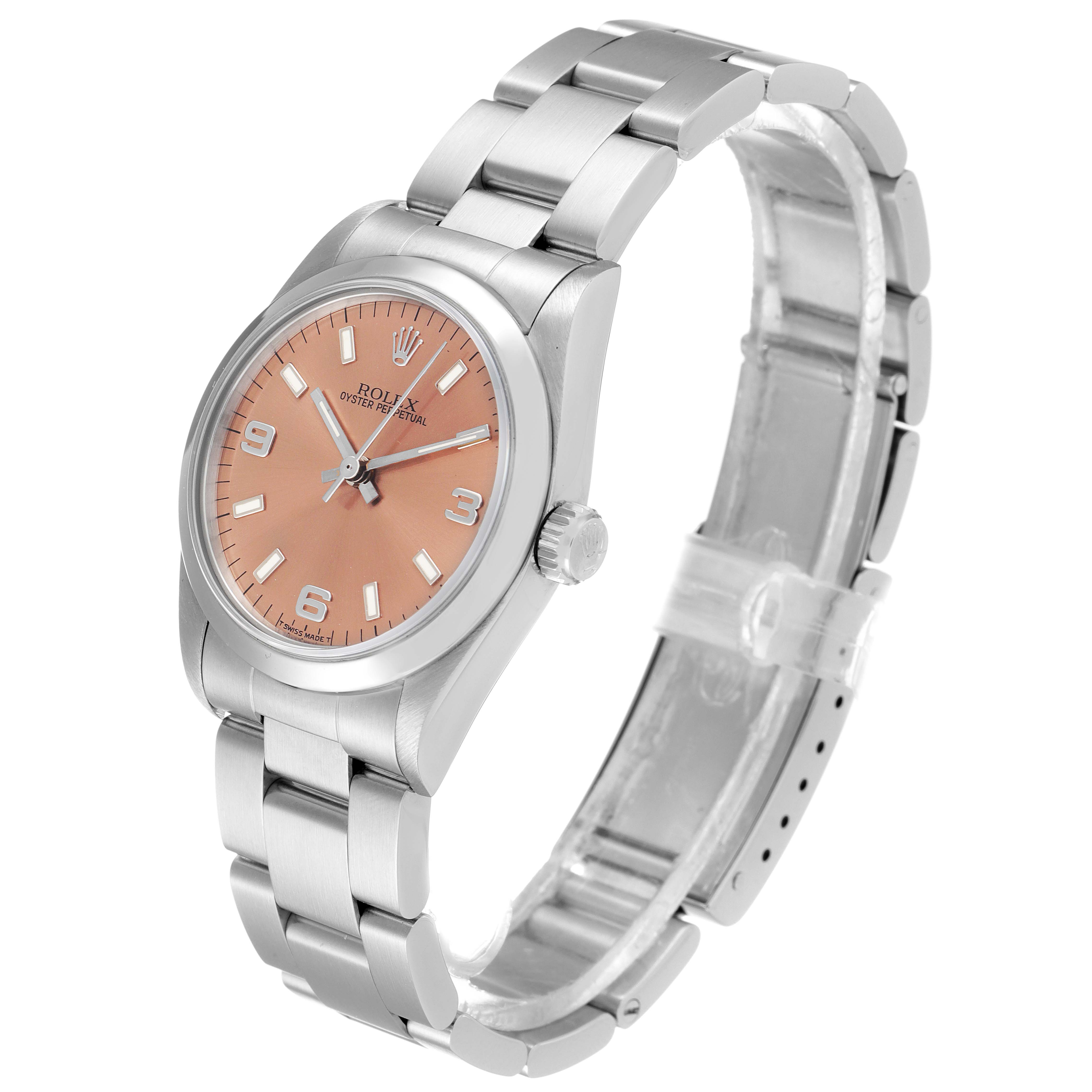 The image shows a Rolex Mid-Size 67480 Women's Stainless Steel Pink Dial 67480 Women's Stainless Steel Pink Dial model watch from a front-side angle, highlighting the dial, bezel, crown, and bracelet.