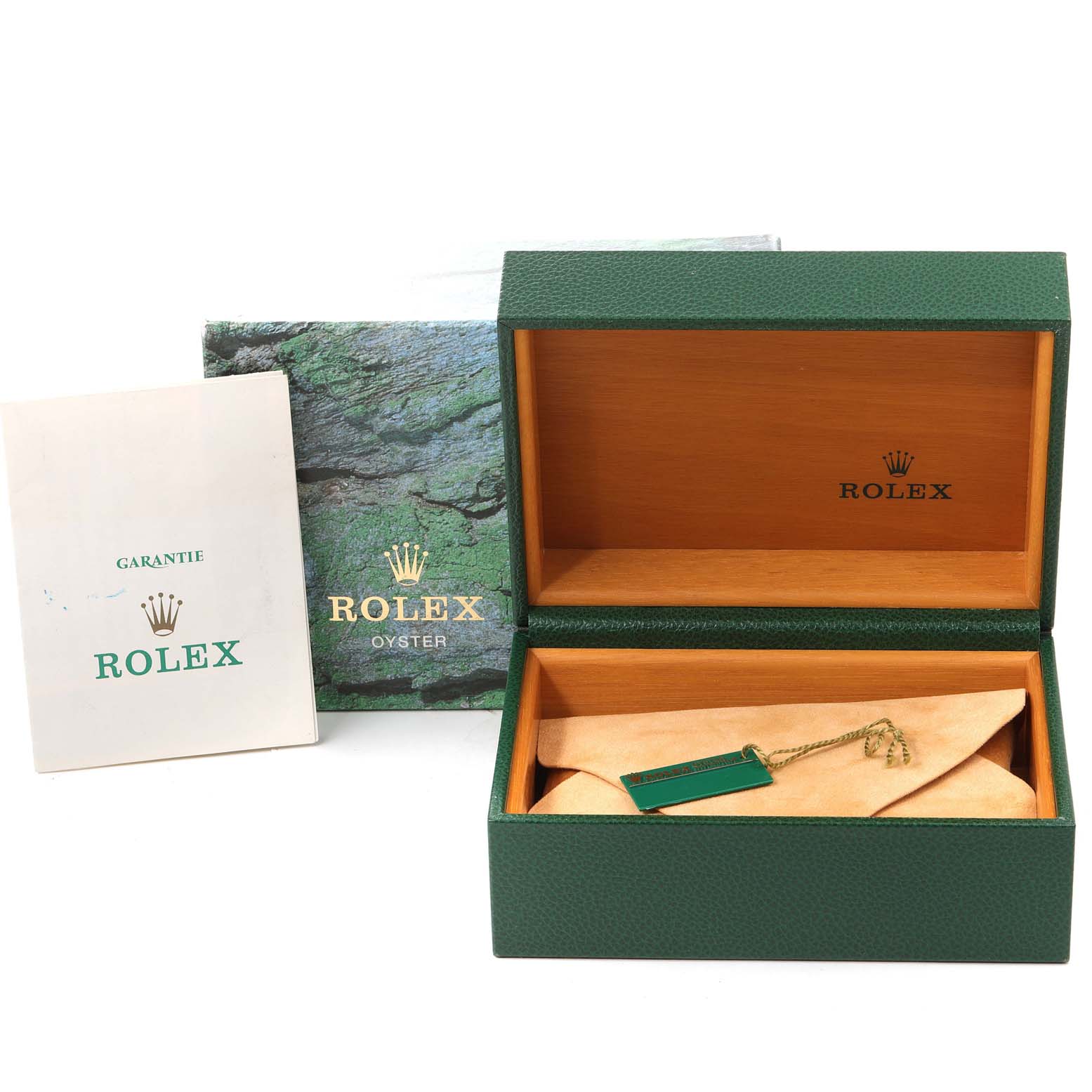 The image shows a green Rolex box, booklet, and tag for the Mid-Size model.