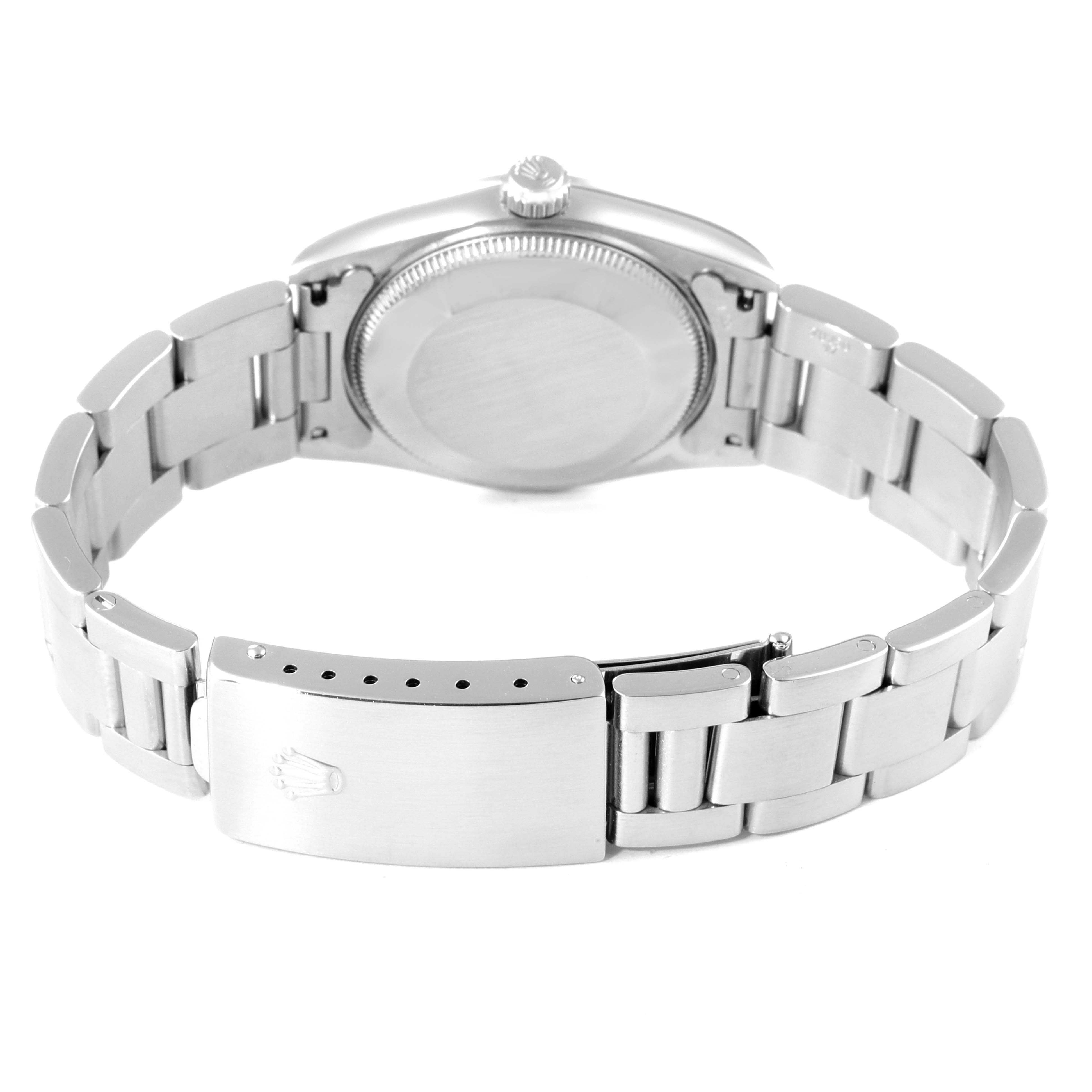 The image shows the back side and bracelet of a Rolex Mid-Size 67480 Women
s Stainless Steel Blue Dial 67480 Women
s Stainless Steel Blue Dial watch, highlighting the clasp and case back.