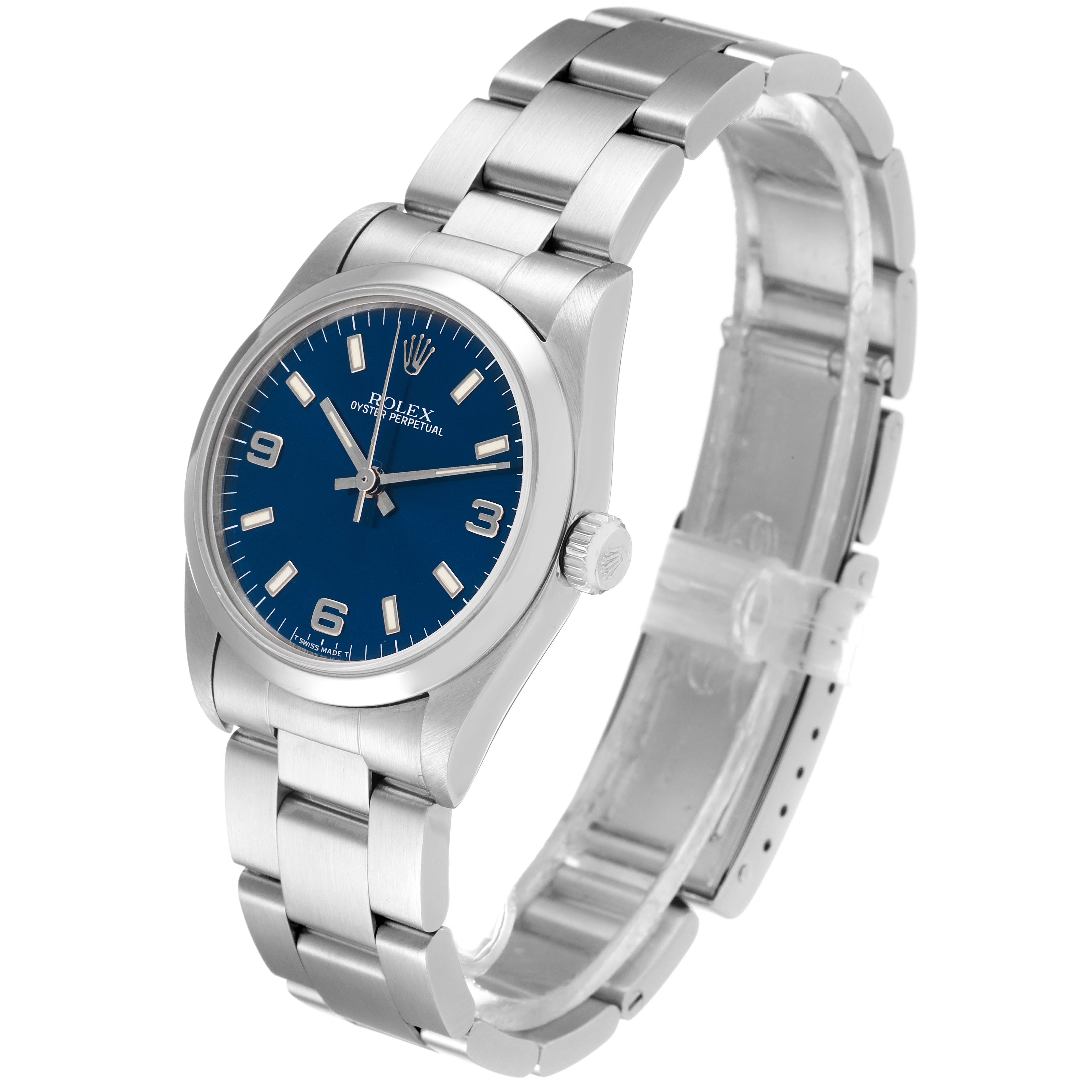 The image shows a Rolex Mid-Size 67480 Women
s Stainless Steel Blue Dial 67480 Women
s Stainless Steel Blue Dial Oyster Perpetual watch at a slight angle, highlighting its blue dial and stainless steel bracelet.