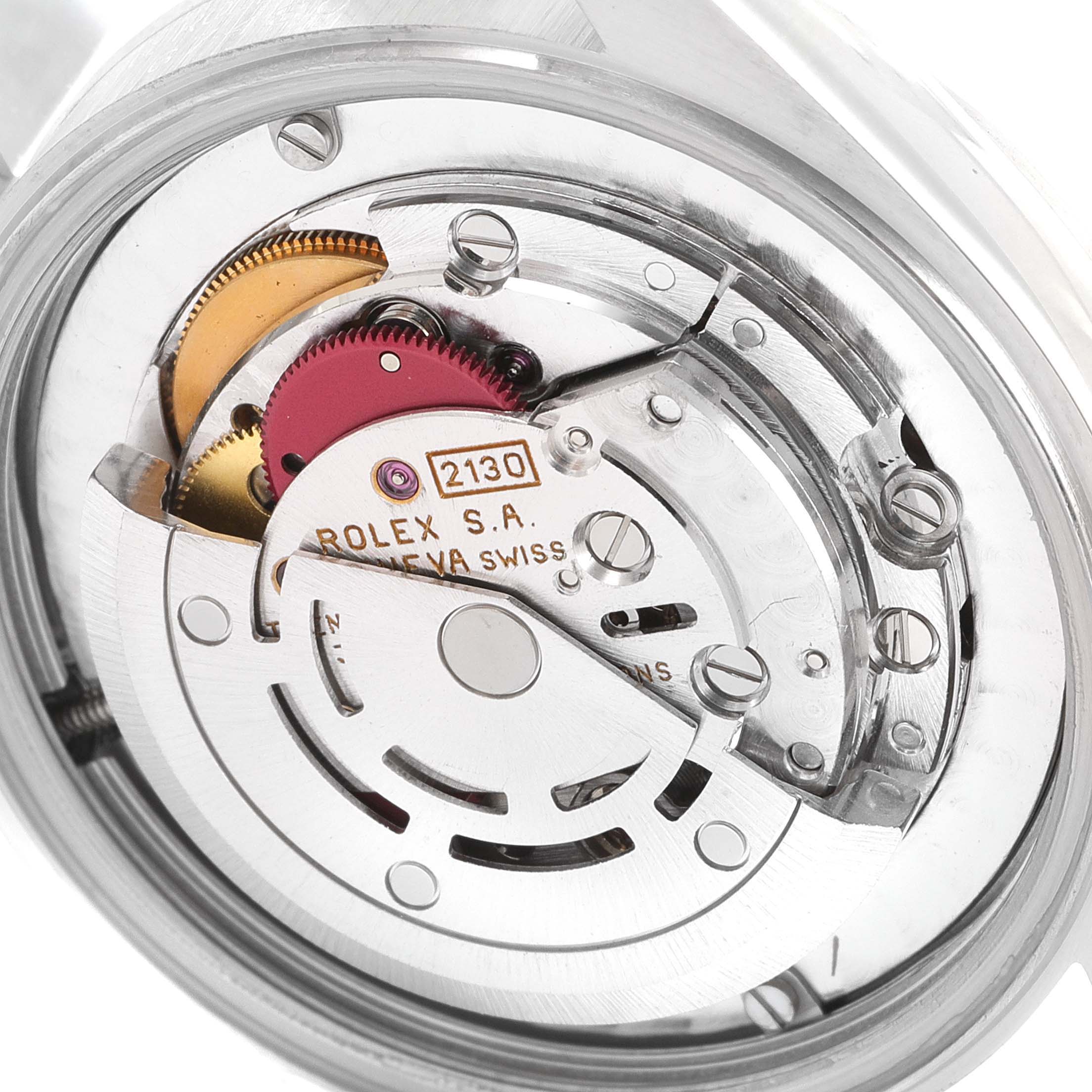 This image shows the internal movement mechanism of a Mid-Size Rolex watch.