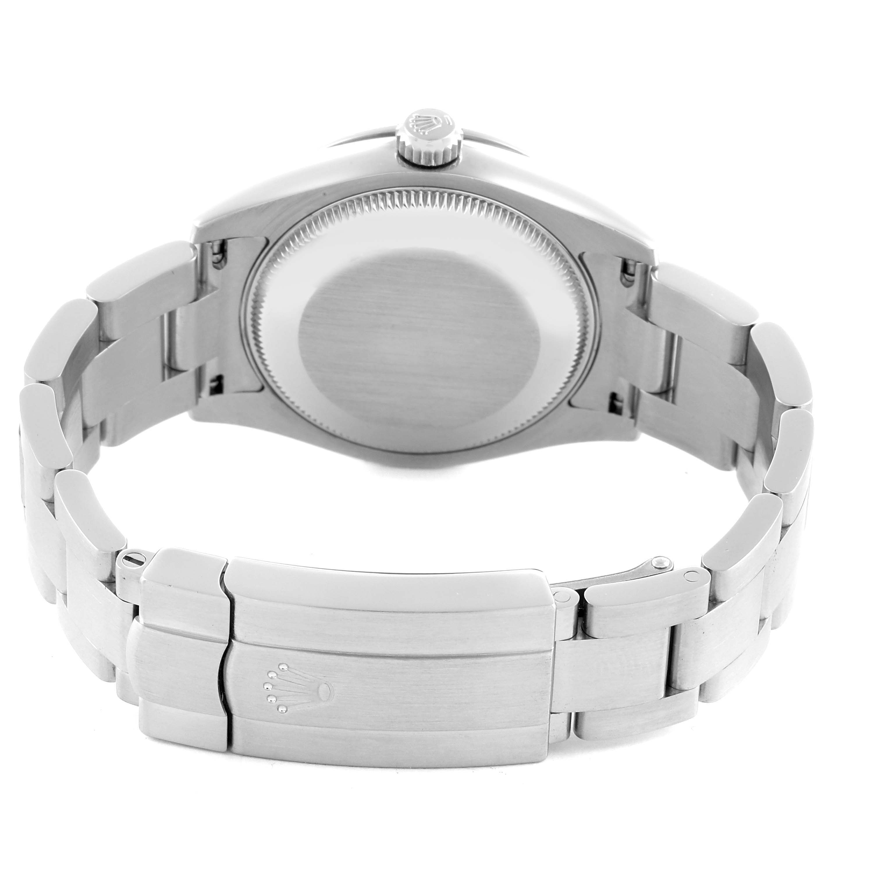 The image shows the back and clasp of a mid-size Rolex watch, highlighting the case back and bracelet clasp.