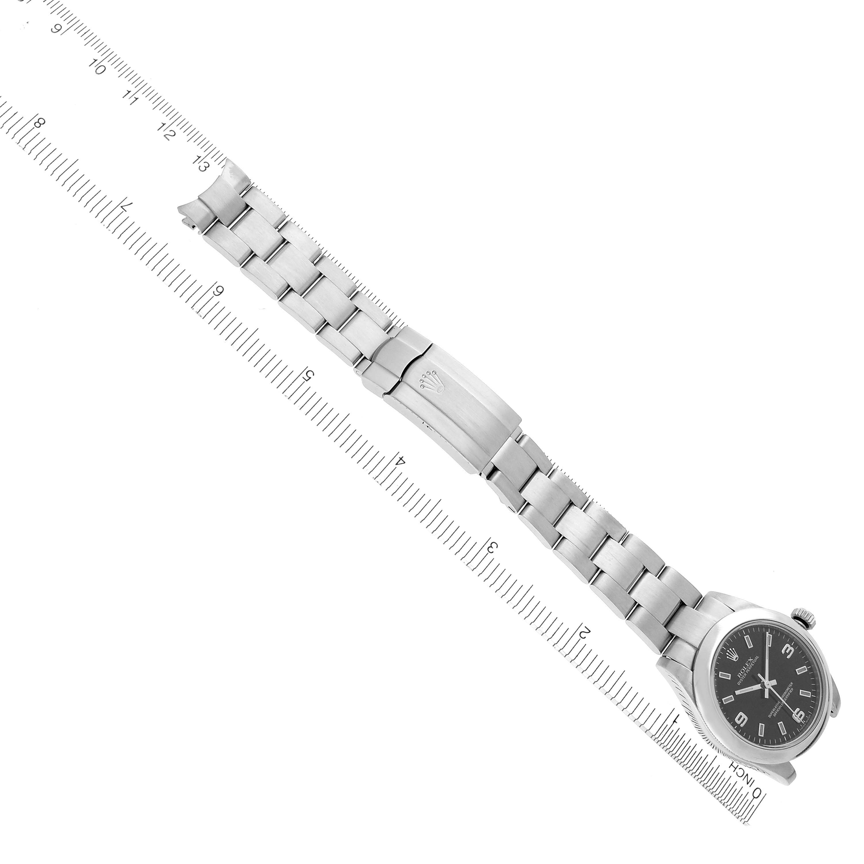The image shows a top view of a Rolex Mid-Size 177200 Women's Stainless Steel Black Dial 177200 Women's Stainless Steel Black Dial watch, featuring its full bracelet and clasp.