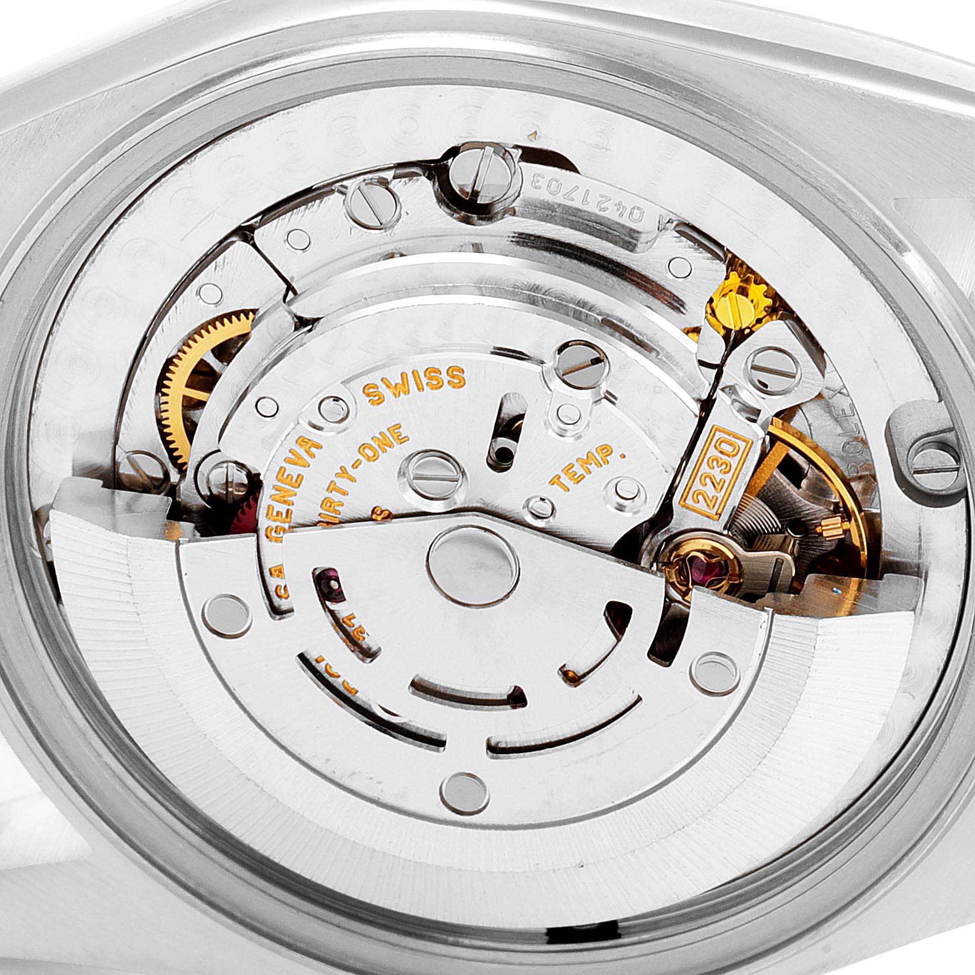 This image shows the internal mechanism of a Rolex Mid-Size 77014 Women
s Stainless Steel White Dial 77014 Women
s Stainless Steel White Dial model watch from a close-up angle, highlighting its intricate components.