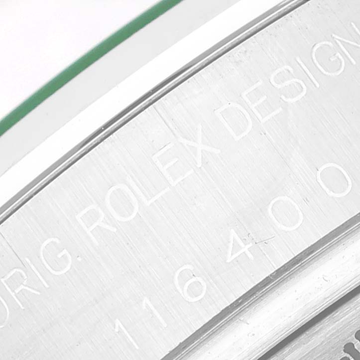 The image shows a close-up of the engraved bezel with serial numbers of a Rolex Milgauss 116400GV Men's Stainless Steel Blue Dial 116400GV Men's Stainless Steel Blue Dial watch.