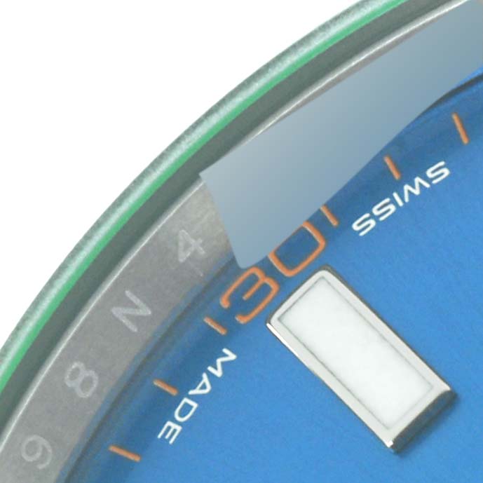 The image shows a close-up of the dial and part of the bezel of the Rolex Milgauss 116400GV Men's Stainless Steel Blue Dial 116400GV Men's Stainless Steel Blue Dial watch, focusing on the hour markers and "SWISS MADE" text.