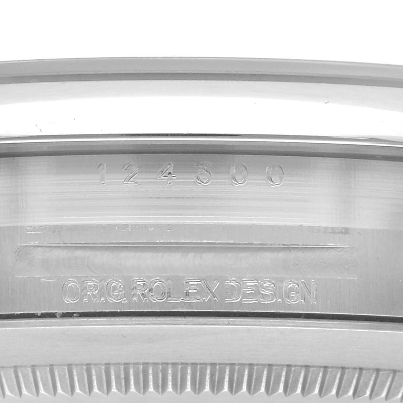 The image shows a close-up of the side engraving on the case of a Rolex Oyster Perpetual 124300 Men's Stainless Steel Silver Dial 124300 Men's Stainless Steel Silver Dial watch.