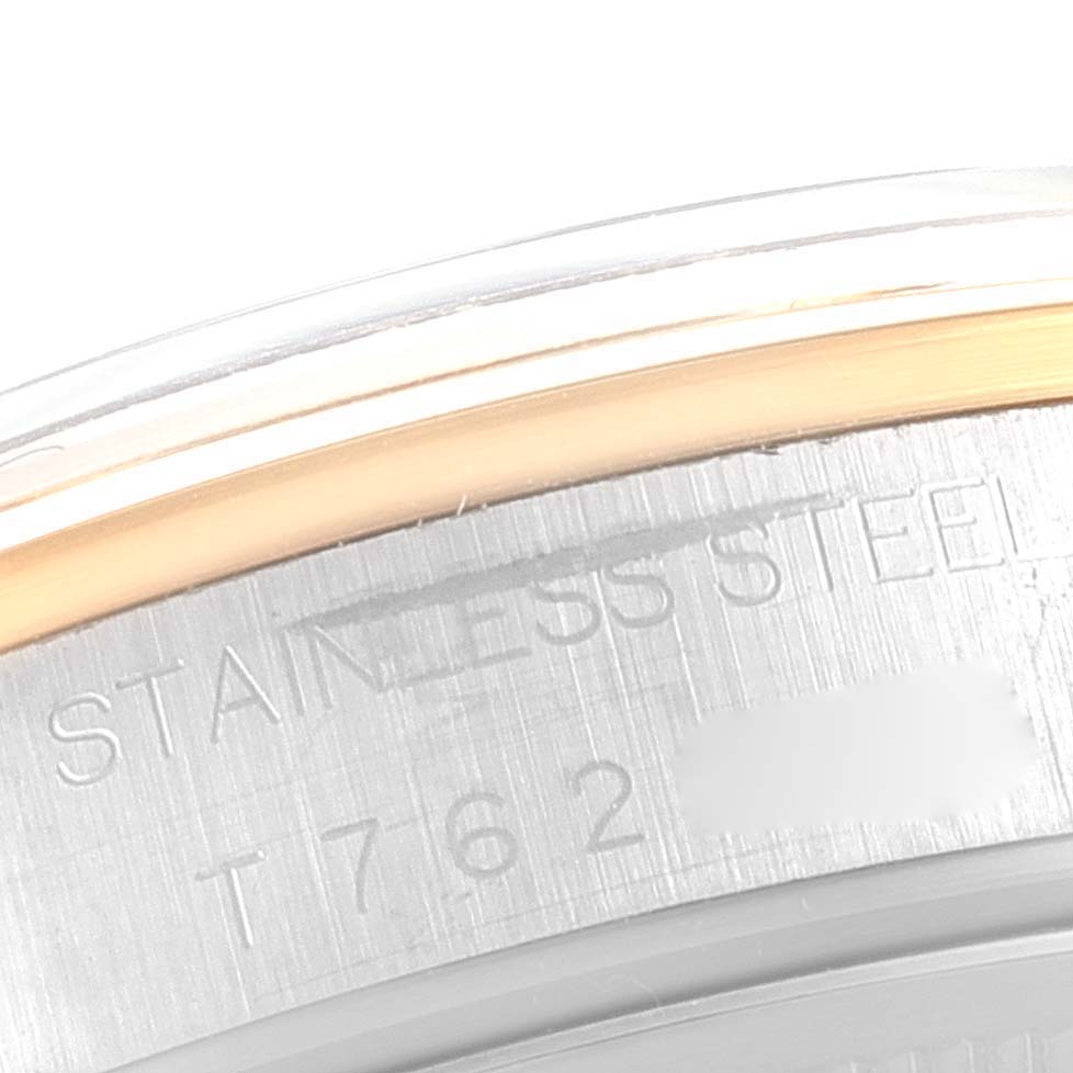 This image shows a close-up of the side of the stainless steel case on a Rolex Oyster Perpetual 14203 Men
s Steel and Gold (two tone) Grey Dial 14203 Men
s Steel and Gold (two tone) Grey Dial watch.