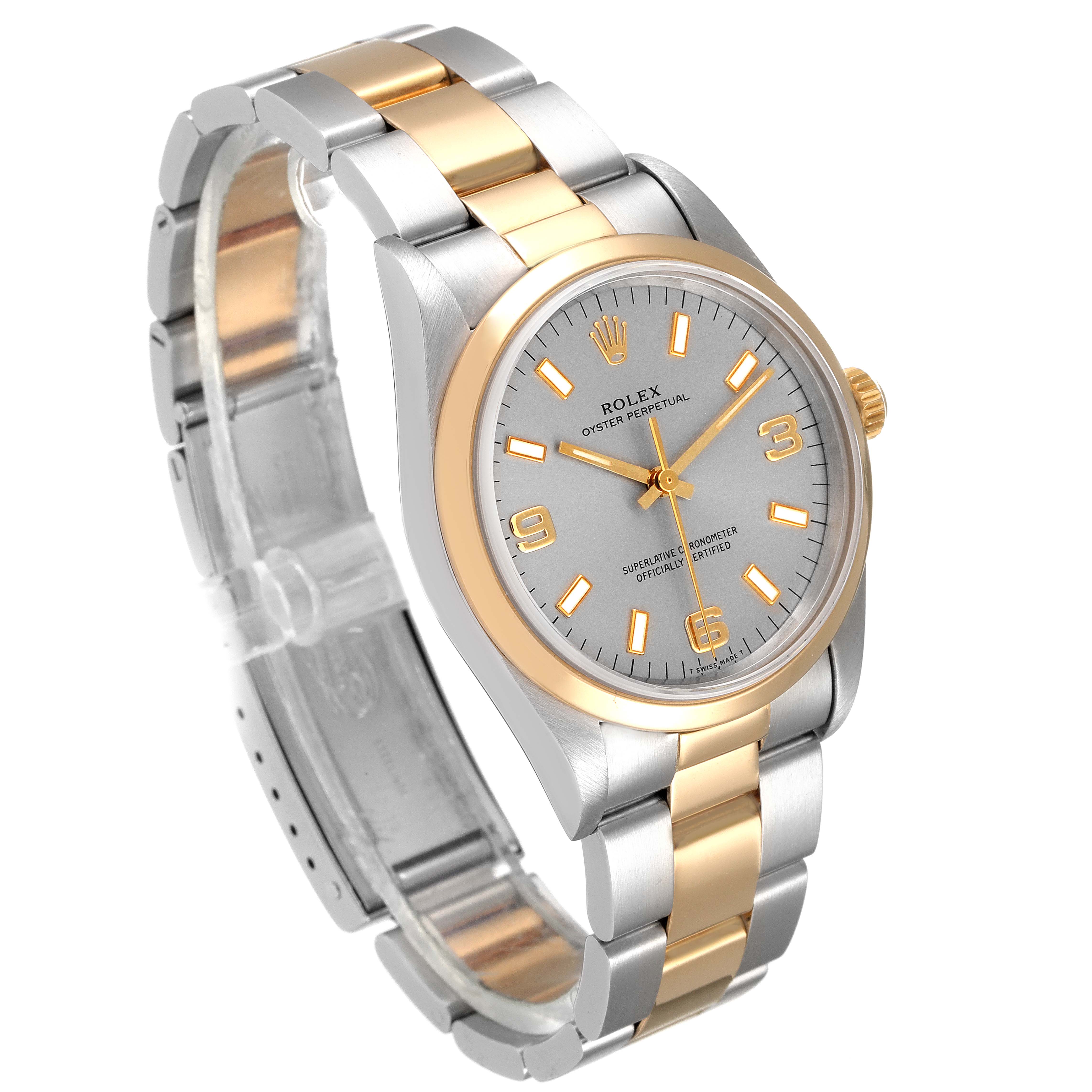 The Rolex Oyster Perpetual 14203 Men
s Steel and Gold (two tone) Grey Dial 14203 Men
s Steel and Gold (two tone) Grey Dial watch is shown at an angled view highlighting the two-tone bracelet, dial, and bezel.
