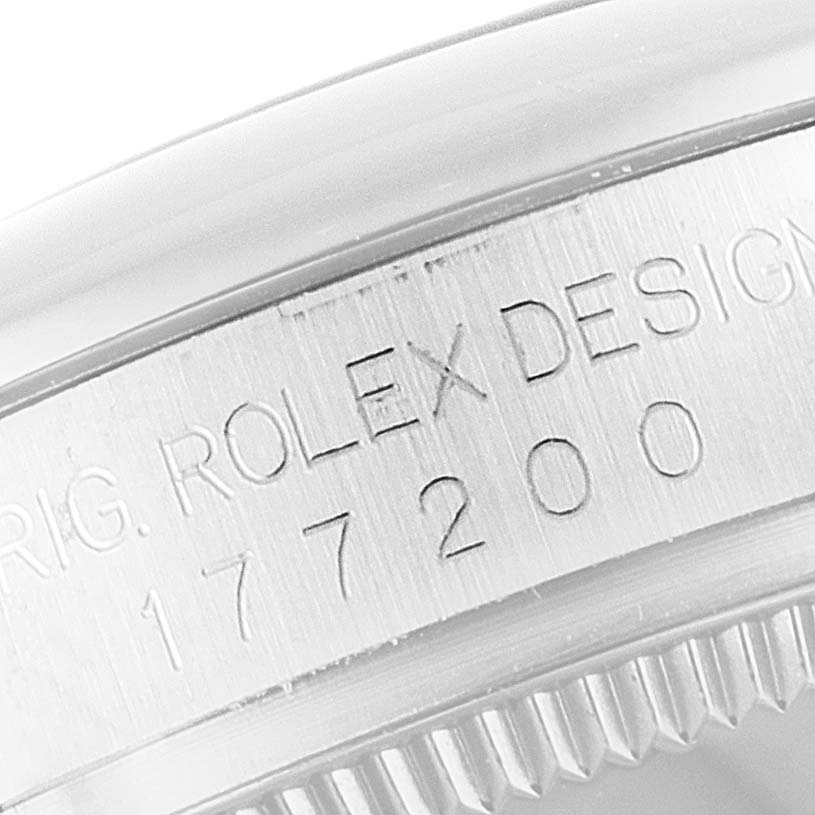 This image shows a close-up angle of the serial number engraving on the case of a Rolex Mid-Size 177200 Women's Stainless Steel Grey Dial 177200 Women's Stainless Steel Grey Dial model watch.
