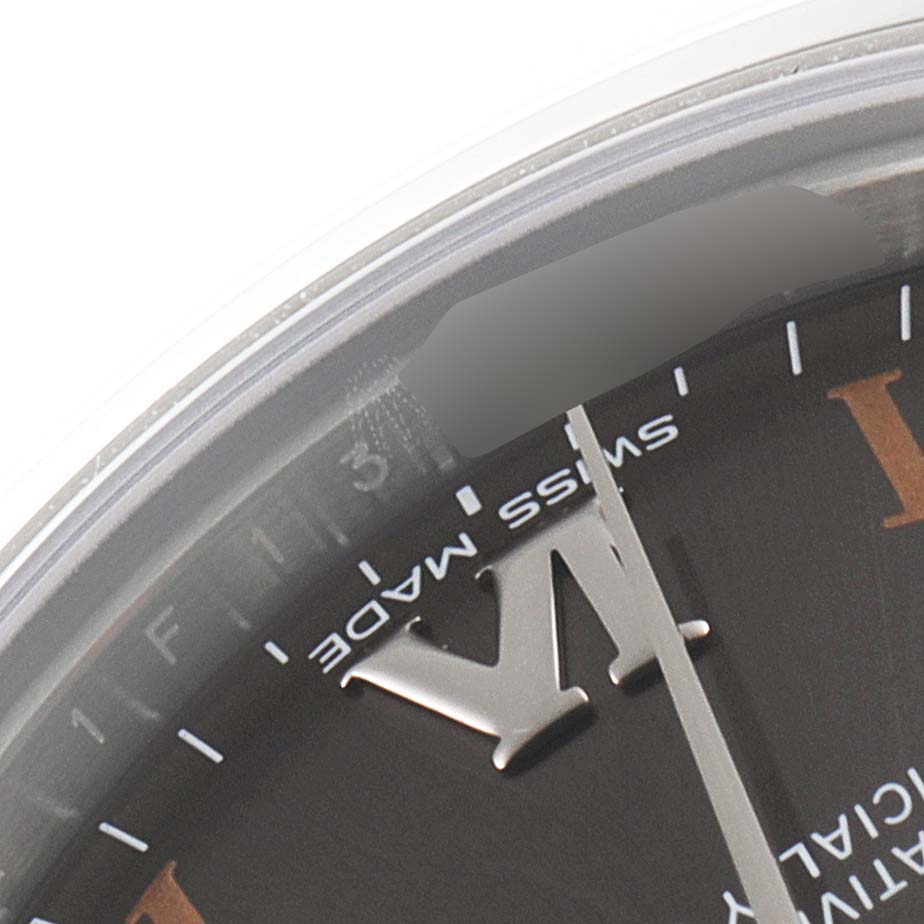 This close-up image shows a portion of the dial of a Rolex Mid-Size 177200 Women's Stainless Steel Grey Dial 177200 Women's Stainless Steel Grey Dial watch, highlighting the "Swiss Made" text and Roman numerals.