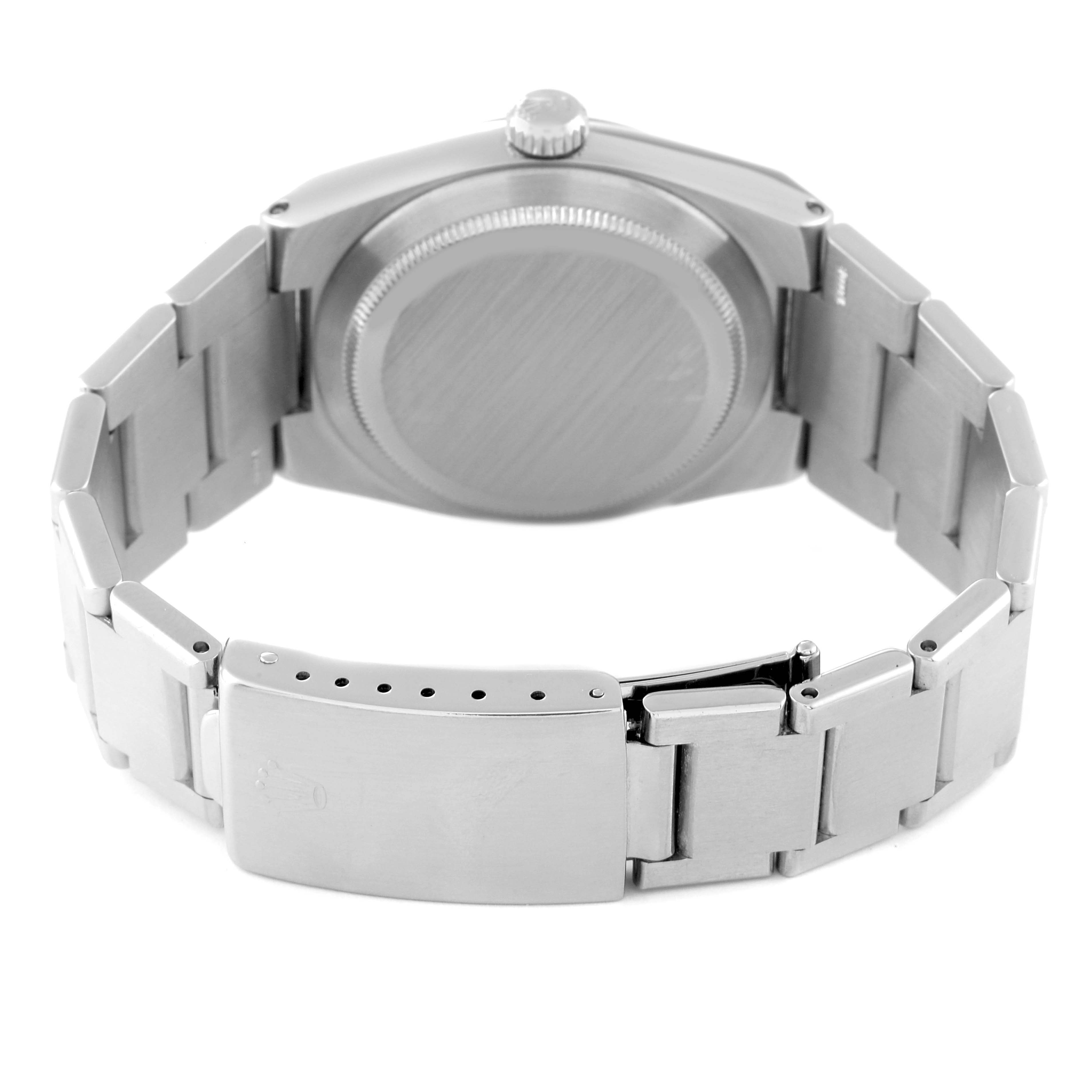 This image shows the back view of an Oysterquartz model by Rolex, highlighting the bracelet and clasp.