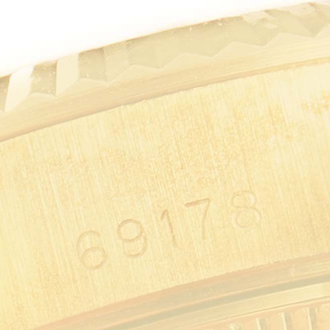 This image shows a close-up of the case and serial number engraving on a Rolex President 69178 Women
s Yellow Gold Champagne Dial 69178 Women
s Yellow Gold Champagne Dial model watch.