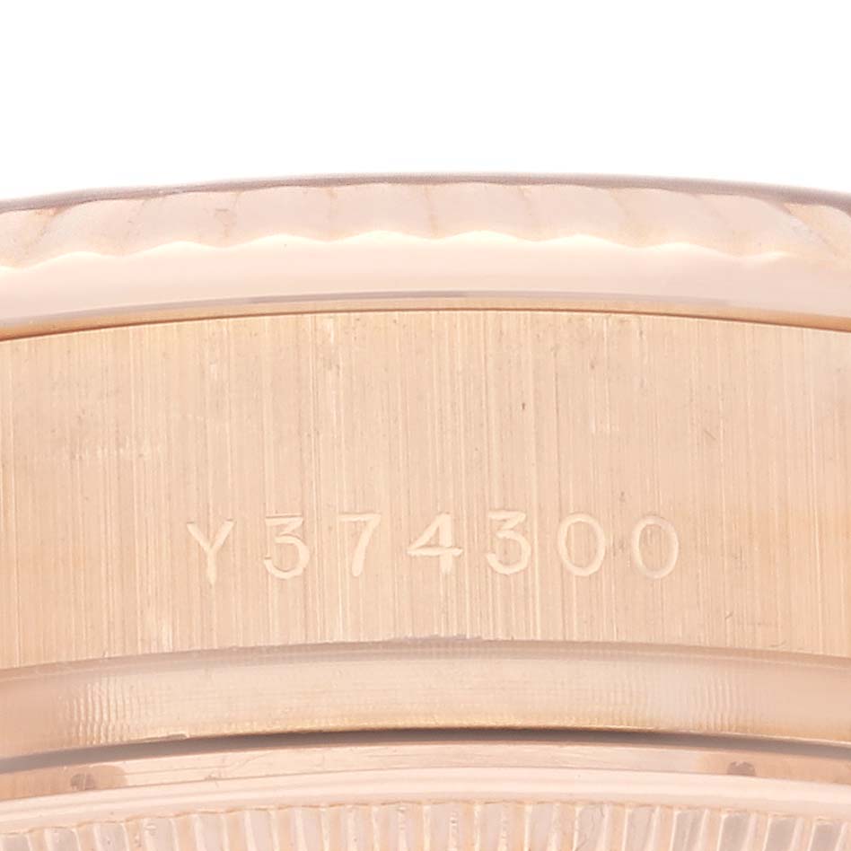 The image shows a close-up of the Rolex President 179175 Women's Rose Gold Silver Dial 179175 Women's Rose Gold Silver Dial model's case side, highlighting the serial number engraving.