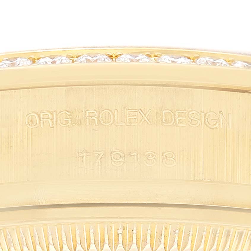 The image shows a close-up of the engraved side of a Rolex President 179138G Women's Yellow Gold Champagne Dial 179138G Women's Yellow Gold Champagne Dial Model watch.