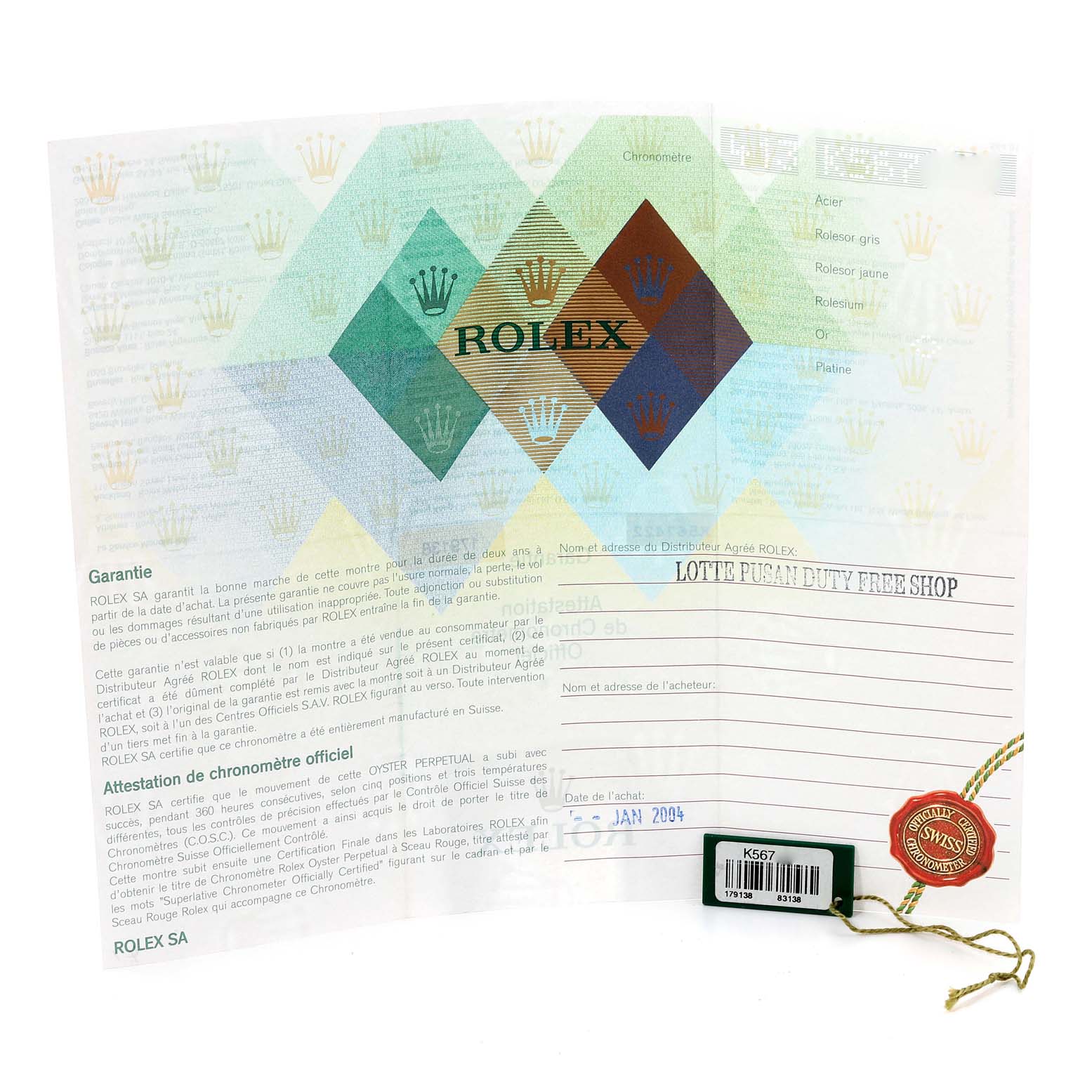 This image shows a warranty card and hangtag for the Rolex President 179138G Women's Yellow Gold Champagne Dial 179138G Women's Yellow Gold Champagne Dial model, with the warranty card issued by LOTTE PUSAN DUTY FREE SHOP dated January 2004.