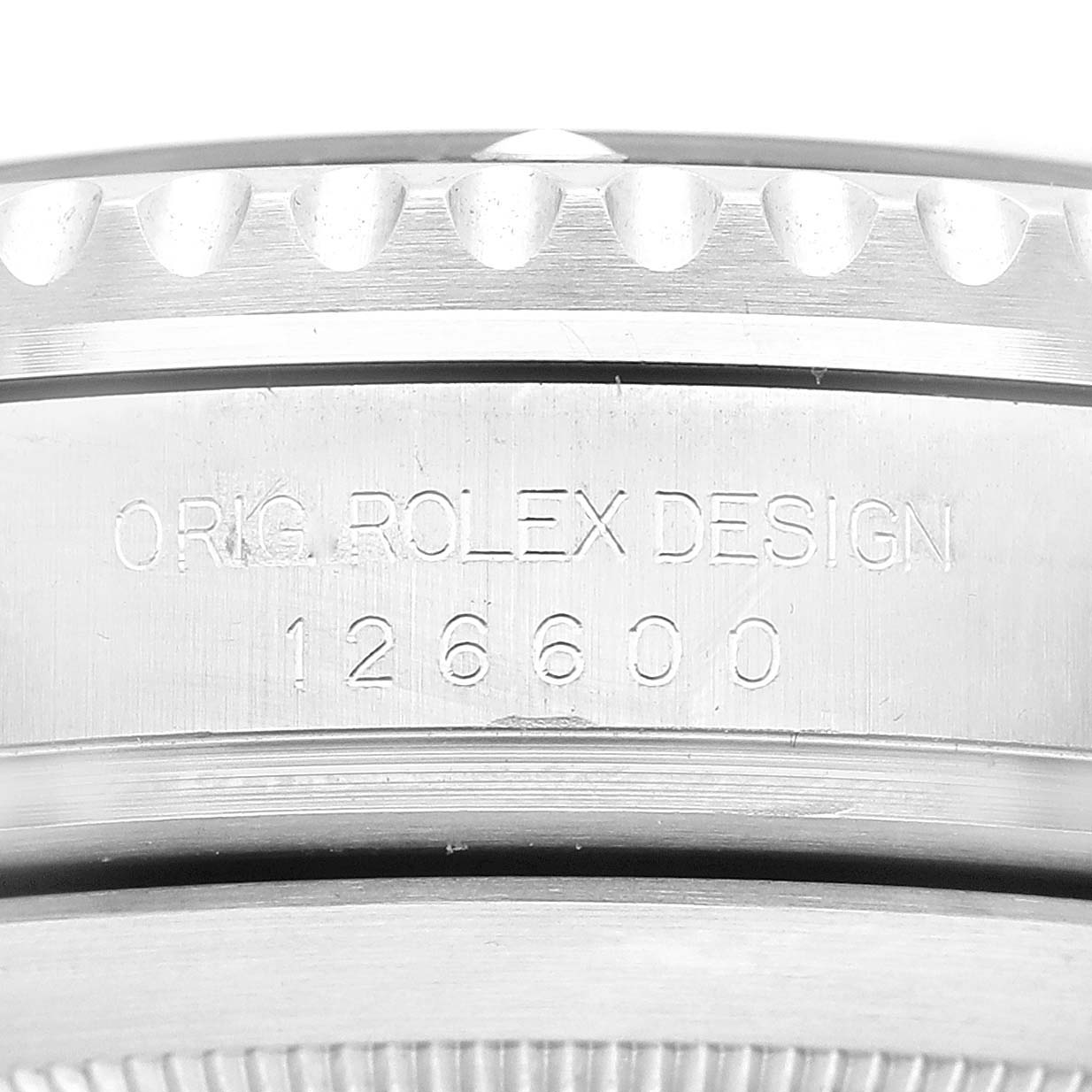 This close-up image shows the engraved side of the case on a Rolex Sea-Dweller 126600 Men
s Stainless Steel Black Dial 126600 Men
s Stainless Steel Black Dial, model 126600.