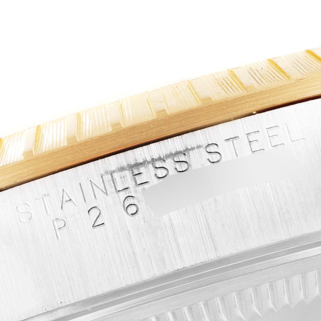 This close-up image shows the stainless steel and gold fluted bezel of a Rolex Date 15223 Men's Steel and Gold (two tone) Black Dial 15223 Men's Steel and Gold (two tone) Black Dial watch.