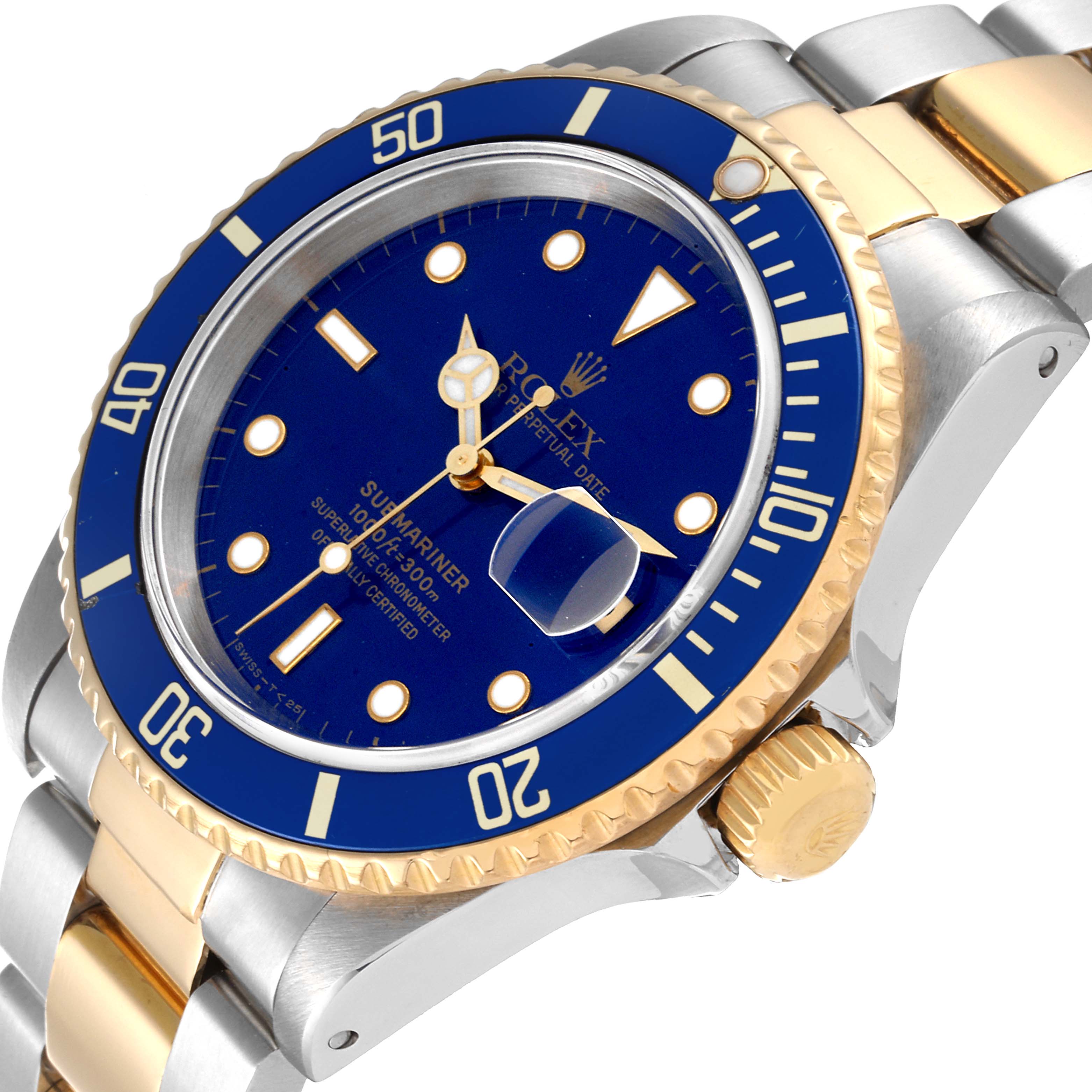 This image shows a close-up of the Rolex Submariner 16613 Men's Steel and Gold (two tone) Blue Dial 16613 Men's Steel and Gold (two tone) Blue Dial watch face and bezel from an angled perspective, highlighting its gold and stainless-steel bracelet.