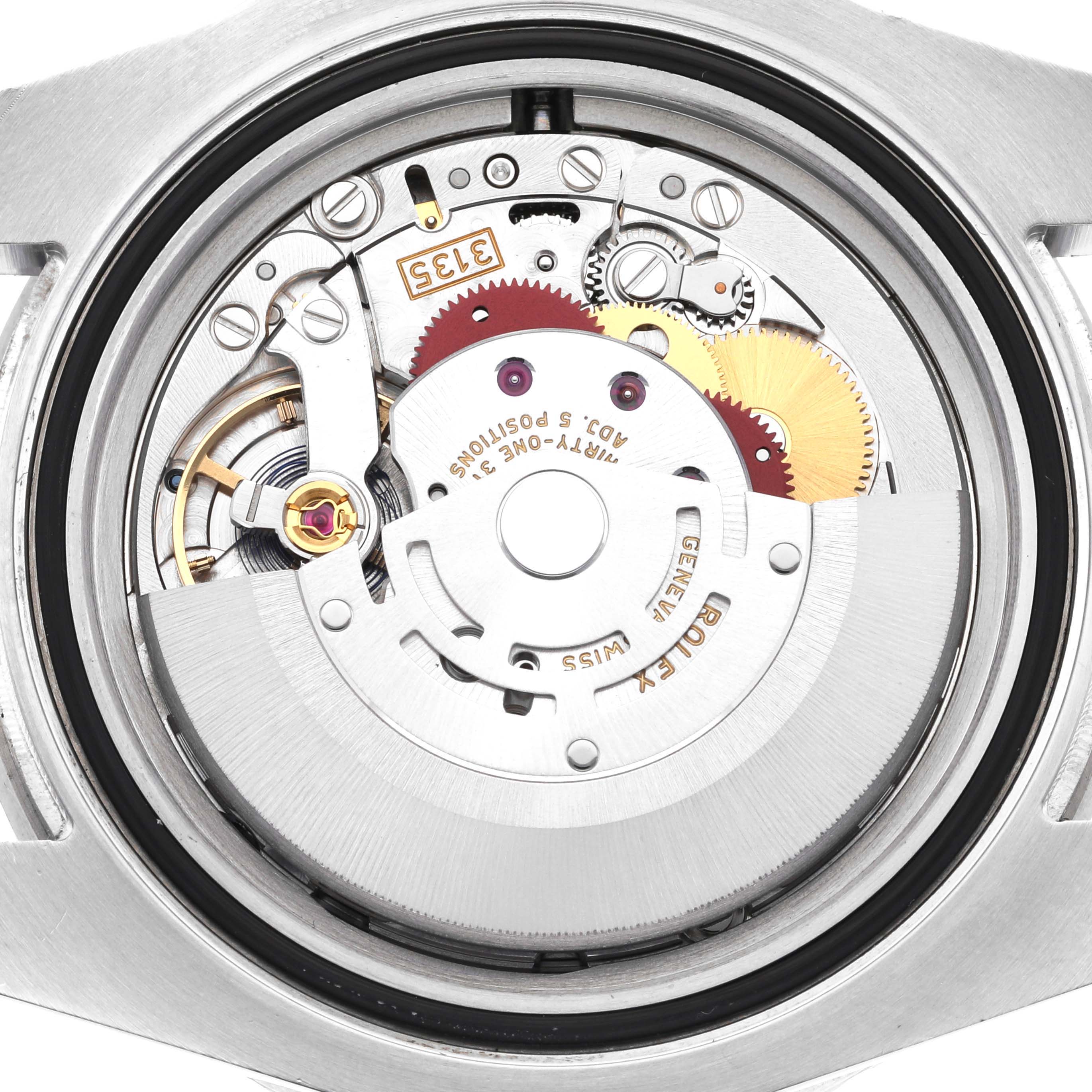 The image shows the back view of the Rolex Submariner 116610LV Men's Stainless Steel Green Dial 116610LV Men's Stainless Steel Green Dial, highlighting its intricate movement components.