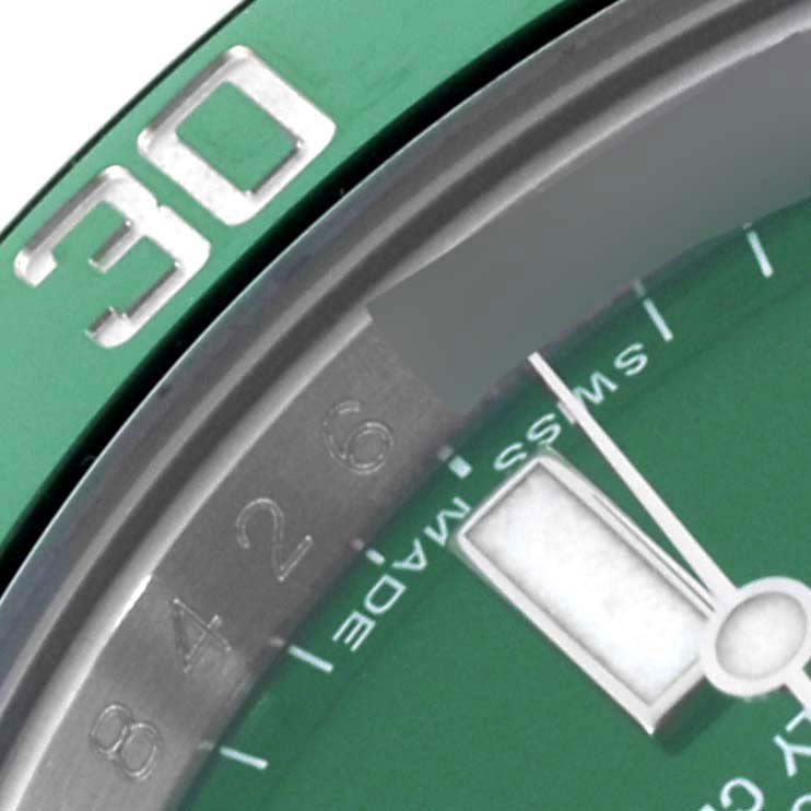 The image shows a detailed close-up of a green Submariner bezel with "30" marking by Rolex.