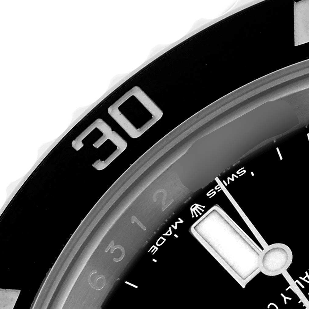 The image shows the bezel and part of the dial of a Rolex Submariner 124060 Men's Stainless Steel Black Dial 124060 Men's Stainless Steel Black Dial, focusing on the 30-minute mark.