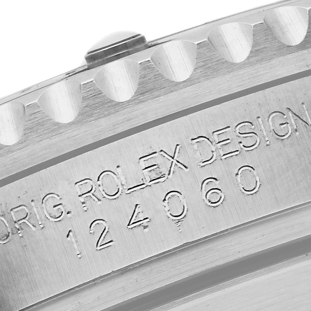 The image shows a close-up of the inner case engraving and bezel edge of a Rolex Submariner 124060 Men's Stainless Steel Black Dial 124060 Men's Stainless Steel Black Dial watch.