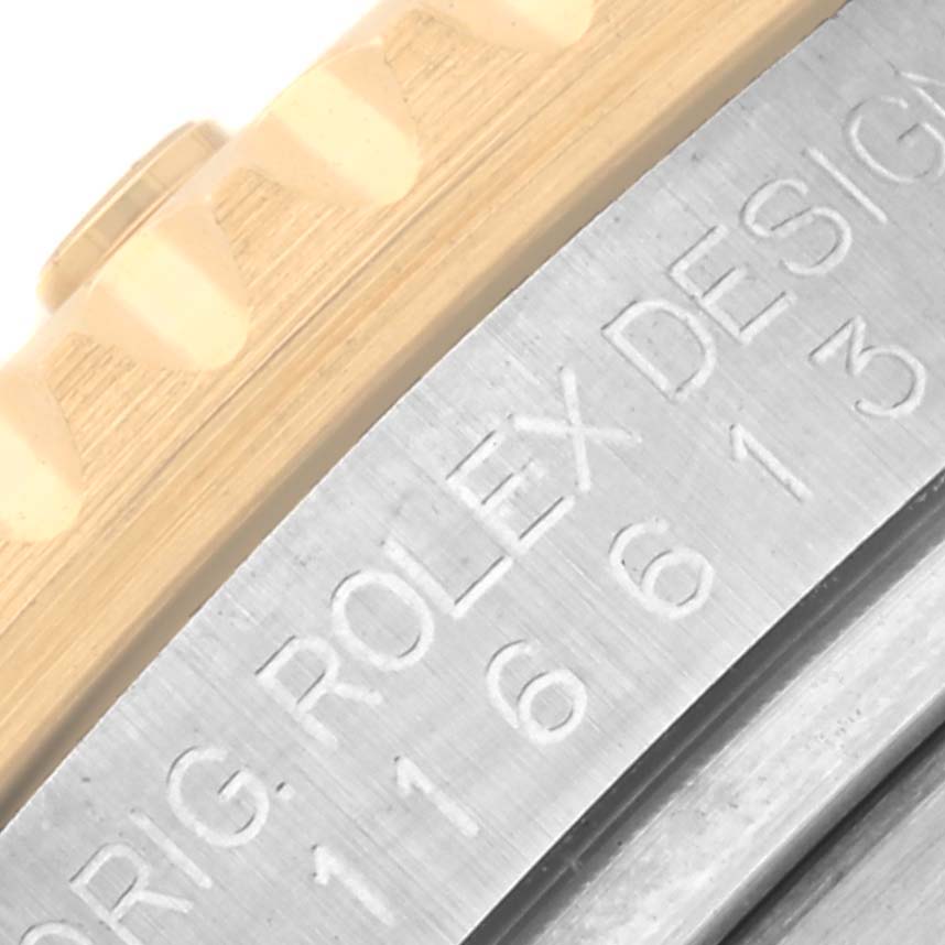 The image shows a close-up of the bezel and case side of a Rolex Submariner 116613 Men's Steel and Gold (two tone) Blue Dial 116613 Men's Steel and Gold (two tone) Blue Dial, highlighting the engraved model number.